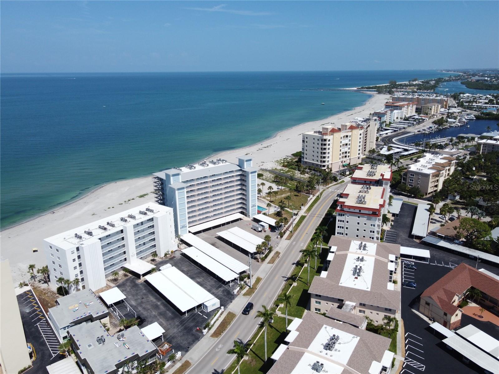 Welcome to Gulf Horizons, a premier beachfront community on the Island of Venice. This 5th-floor unit features breathtaking 180 degree Gulf views from both the screened balcony and master suite — ideal for enjoying nightly sunsets, listening to the waves, and watching the dolphins pass by. The spacious primary suite features a walk-in closet and en-suite bathroom. Both the primary bedroom and living room have floor-to-ceiling, wall-to-wall storm-rated glass doors. Additional features include a new A/C system, newer water heater, and storm-rated windows. The building has seen major improvements including a new roof, fresh exterior paint, elevator upgrades, and soon will be offering a club-room and beachside pool. This beachfront unit is a blank canvas ready for your personal touch. It’s just a short distance to shops and dining in downtown historic Venice. This is a smoke-free condominium that offers an extra storage room for each unit and covered parking. Note: Property had water intrusion issues from above floors, and has been professionally remediated with essential repairs completed. Seller is licensed Florida Real Estate agent.