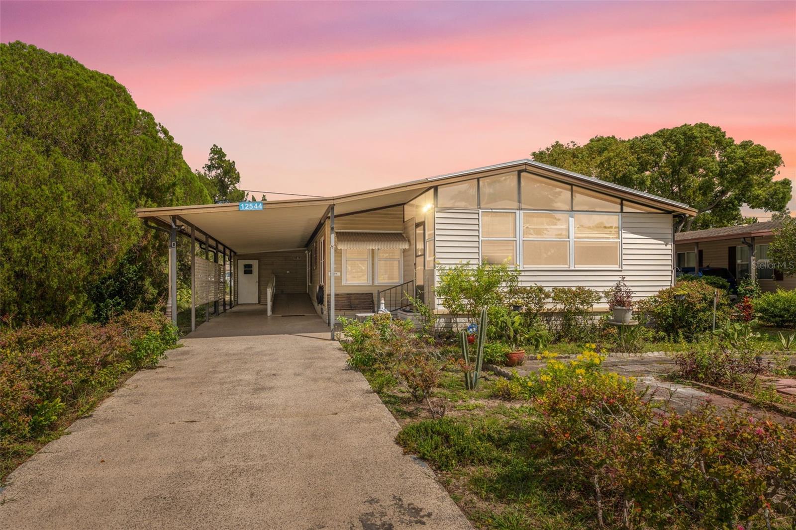 Step into comfort and convenience with this spacious 3-bedroom, 2-bath double-wide manufactured home offering over 1,700 sq. ft. of living space. Major updates include a new roof (2020), brand new AC installed August 2025, and window/door replacements (2017), giving peace of mind for years to come.
Inside, you’ll find an inviting open floor plan with a bright living room featuring a cozy fireplace, a formal dining area, and a well-equipped kitchen with ample cabinetry, stainless steel appliances, and generous counter space. The split-bedroom design ensures privacy, with a large primary suite offering dual closets and an ensuite bathroom with a walk-in shower and vanity.
Additional highlights include indoor laundry hookups, a flex Florida room with a hot tub (included, sold as-is, not used in recent years), and a workshop/storage area for hobbies or tools.
Enjoy outdoor living with a private deck and fenced yard shaded by mature trees, perfect for relaxing or entertaining.
This home is nestled in a vibrant 55+ golf community with amenities that go far beyond the fairways. Residents enjoy pickleball, shuffleboard, bocce ball, cornhole, horseshoes, basketball, table games, puzzles, library, entertainment events, a community pool, Veterans Memorial, dog park, and even a storage yard for vehicles and trailers (check HOA for details).
Conveniently located near shopping, dining, and major roadways, this home blends comfort, lifestyle, and community in one great package.