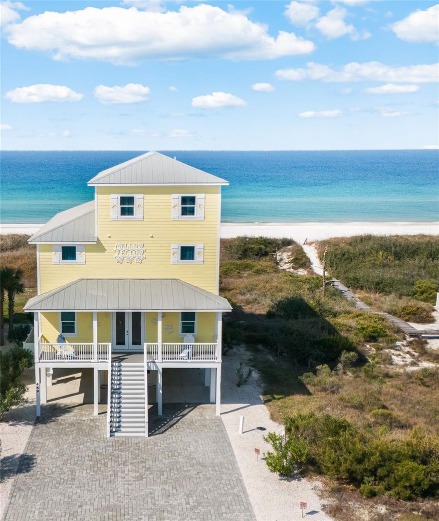 Positioned on a ½-acre homesite in Cape San Blas, “Mellow Yellow” is an expansive 7-bedroom, 7 full bath, 2 half bath coastal retreat located within a gated community. This stunning beach house offers the perfect blend of luxury, space, and income potential—all just steps from the beach.
Built in 2018 and offering 4,840 square feet under air, this thoughtfully designed home features luxury vinyl plank flooring throughout, along with granite and quartz finishes that combine durability with elevated style. Each of the seven bedrooms includes its own private en-suite bath and closet, providing comfort and privacy for guests and owners alike.
The main living level is designed for gathering, with an open-concept layout that seamlessly connects the living room, kitchen, and dining area. A bedroom, laundry room, half bath, oversized walk-in pantry, and storage closet are also conveniently located on this level. Just off the living room, step out to the pool deck featuring a heated pool and generous outdoor entertaining space—perfect for relaxing after a day at the beach.
The third level offers four spacious bedrooms, each with private baths and walk-in closets. Two of these bedrooms enjoy Gulf views and access to a shared balcony, ideal for catching coastal breezes and sunset skies.
The top floor includes the primary suite with a private Gulf-view balcony, walk-in closet, and en-suite bath, along with an additional bedroom currently set up as a children’s room with two sets of bunk beds, a sitting area, closet, and private bath.
Additional features include an elevator servicing all levels, a bar area with wine/beer refrigerator, full-size ice maker, outdoor shower, and a private boardwalk providing direct access to the beach. The ground level offers a one-car pull-in garage with additional storage space—ideal for beach gear such as chairs, surfboards, and kayaks—along with workshop space, an additional half bath, and a large storage closet with both interior and exterior access. The breezeway provides additional covered parking.
Whether you’re searching for a primary residence, private coastal retreat, or an income-producing vacation rental, this property delivers exceptional flexibility. Offered turnkey, it’s ready for immediate enjoyment or rental income.
Spend your days relaxing by the pool, fishing, boating, kayaking, and enjoying the Gulf, and your evenings watching breathtaking sunsets from the balcony or by a campfire on the beach. Located just minutes from St. Joseph Peninsula State Park and local favorites like Skully’s Low Country Boil, Indian Pass Raw Bar, and Cone Heads 8020, this is coastal living at its best. Schedule your private tour today!