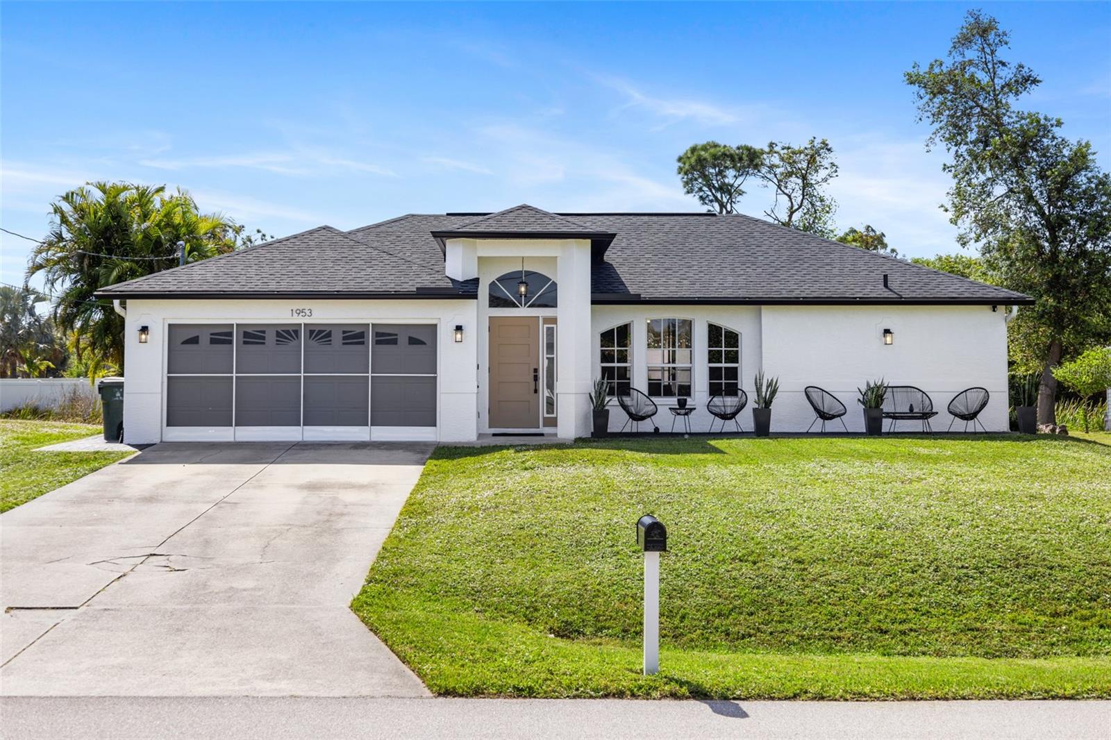 Back on the market – previously off-market while a garage was renovated, now move-in ready and improved from before! Discover this stunning updated 3-bedroom, 2-bathroom home featuring a 2-car garage centrally located within North Port. This highly thought-out split floorplan has both fashion and function. Luxury vinyl plank flooring flows beautifully throughout, while the kitchen showcases quartz countertops, shaker cabinets, and stainless appliances. The spacious bedrooms and modern bathrooms have new counters, fixtures, and finishes that sparkle. Move outside to a large backyard and private fenced patio—your outdoor retreat for gathering or relaxing. Upgrades in the recent past include a new roof and storm-resistant exterior doors to give you peace of mind. Offering no HOA or CDD and a highly desirable location near I-75, this house has a checked box on every front. Don’t miss your chance—ask for a private tour today!
