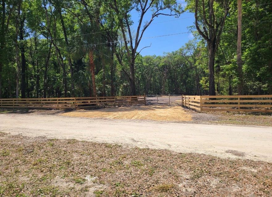 This beautiful gated, mostly fenced property is perfect for your site built home OR manufactured home! Just over 3 acres, the front portion is cleared and grassy, the rear of the property is left natural so you have a built in buffer or you can clear it for more open land! Close to shopping, restaurants, the town of Chiefland and the eight springs in the area for the outdoorsy! Come and see it today!