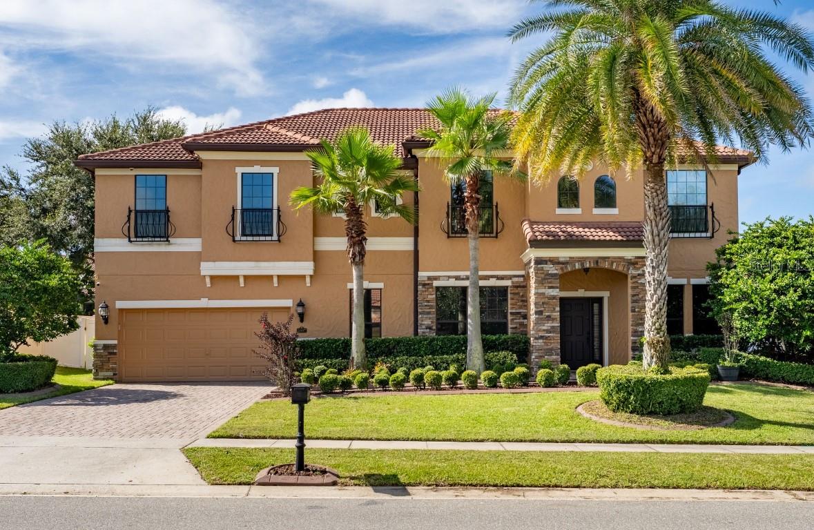 Welcome Home! This energy-efficient Kerrville Model Meritage Home offers an impressive list of upgrades throughout. Nestled in the highly sought-after gated community of Wekiva Springs Estates, this stunning residence boasts 6 bedrooms, 4 bathrooms, and a 3-car tandem garage—all complemented by a sparkling solar-heated saltwater pool. Step inside the grand foyer, where clerestory windows highlight a striking mosaic accent tile. Crown molding, chair rail detailing, and designer touches set the tone as you enter the spacious formal dining and living areas. The gourmet kitchen is a chef’s dream, featuring GE stainless steel appliances, 42” walnut cabinets with crown molding, granite countertops with under-mount sink, glass backsplash, under-cabinet lighting, recessed LED can lights, a breakfast bar, and a large pantry. French doors with built-in blinds open to the expansive covered lanai overlooking the private pool, surrounded by a fenced yard. The family room provides a seamless flow for entertaining, while a first-floor guest suite and full pool bath offer convenience. Upstairs, gather in the loft with an upscale wet bar featuring granite counters and walnut cabinetry. The oversized primary suite is a true retreat with dual vanities, a jetted soaking tub, seamless glass shower with pebble flooring, masculine-height sinks, porcelain tile, and a massive custom walk-in closet by Closets by Design. Every bedroom is outfitted with designer closet systems, and thoughtful upgrades include dimmer switches, LED lighting, tinted windows, brushed bronze hardware, 2” faux wood blinds, water softener, reverse osmosis, generator plug, epoxy-coated garage floor, irrigation system, gutters, pool child-safety fence, termite bait system, and more. Perfectly situated in the heart of Central Florida, this home is minutes from Wekiwa Springs State Park, Sweetwater Golf & Country Club, top-rated schools, and offers easy access to 429 and I-4. Don’t miss the chance to own this luxurious modern pool home—schedule your private showing today!