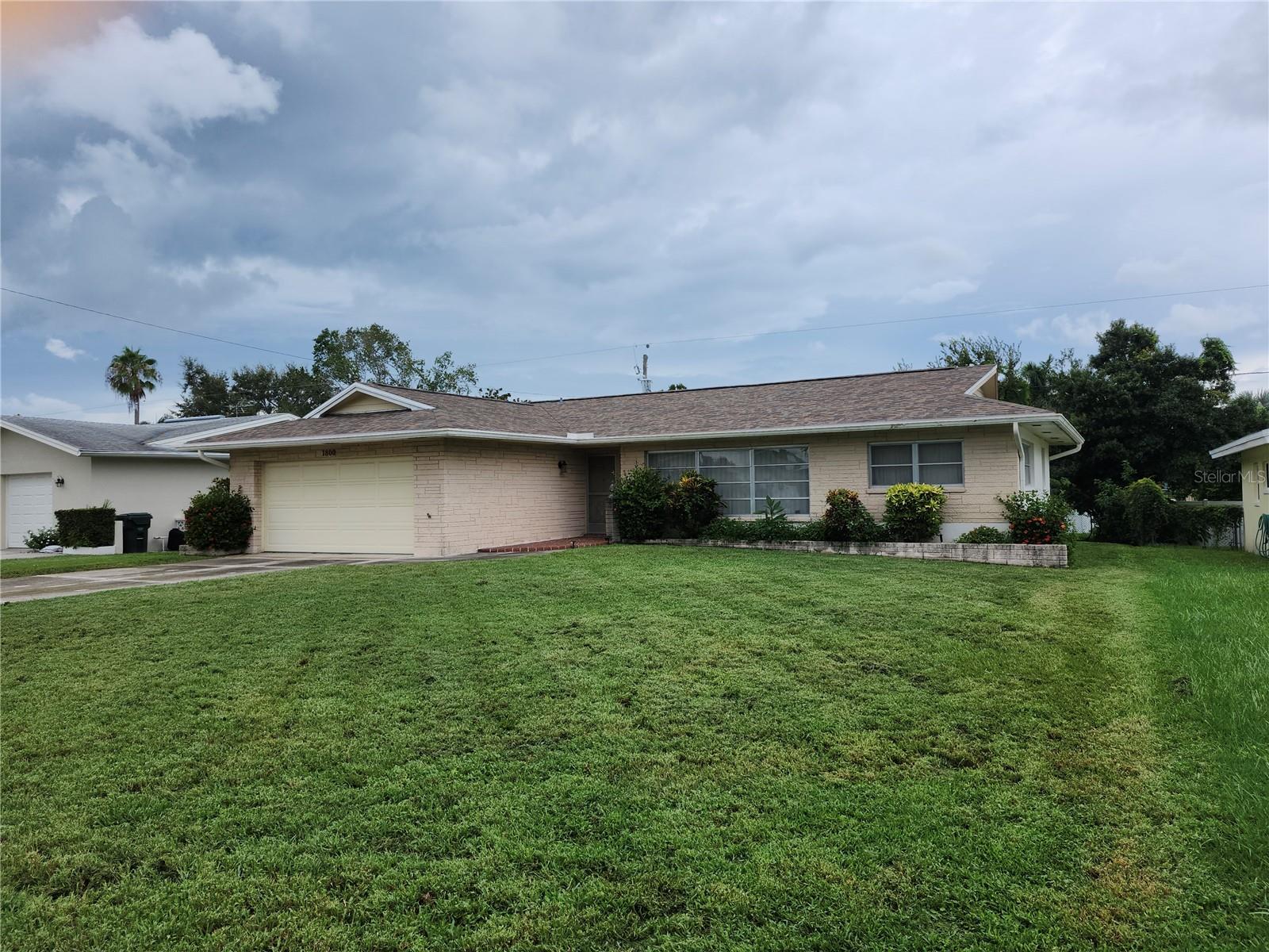 Great central Pinellas County location. Non-evacuation zone. High Elevation. Just minutes to the beaches. The floor plan has a Split bedroom layout with a large living room, dining room, kitchen and bonus room in the middle. It is essentially 2 master suites. The 2nd bedroom and bath have a door for privacy. The master bedroom is perfect for a king sized bed and features 2 closets. The kitchen has updated cabinets and a passthrough to the bonus room. The roof was replaced in 2021, A/C 2021 and duct work was replaced in 2022. The extra large garage is 524sf and has attic access. Beautiful lush green grass and a backyard that is big enough to add a pool. Close to Shopping, Restaurants, schools and hospitals.