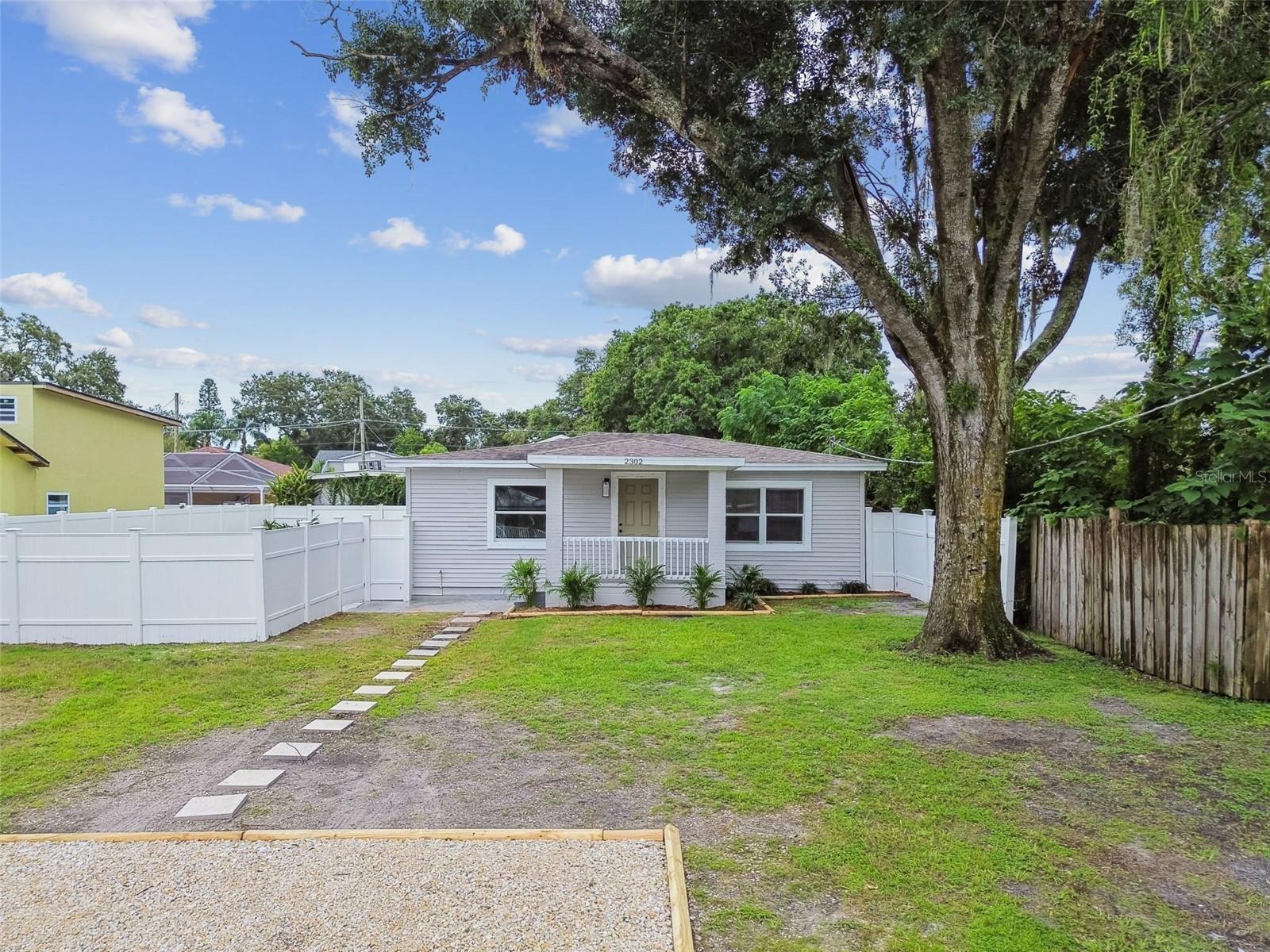 Welcome to this beautifully cosmetically updated and impeccably maintained bungalow, offering the perfect blend of modern updates and timeless charm. From the moment you arrive, you'll be captivated by the expansive front yard and inviting front porch, an ideal spot to enjoy your morning coffee or unwind with a glass of wine in the evening. Step inside to discover a thoughtfully remodeled interior, featuring fresh paint, stylish new laminate flooring, and updated lighting and fixtures throughout. The living room, anchored by a classic brick fireplace, provides a warm and welcoming atmosphere, perfect for both everyday living and entertaining guests. The flexible floor plan includes a front-facing secondary bedroom that makes a fantastic guest room or a bright, inspiring home office. Toward the back of the home, you’ll find a generous primary suite, complete with ample room and a beautifully renovated en suite bathroom featuring modern finishes and custom touches. A dedicated dining room offers space for hosting dinners or intimate gatherings, while the updated kitchen is sure to impress with its crisp white shaker cabinets, granite countertops, subway tile backsplash, open shelving, and stainless-steel appliances. Additional features include a convenient in-home laundry closet, a stylishly updated guest bathroom, and a fully fenced backyard that provides privacy and plenty of room to relax, garden, or entertain, along with a shed for extra storage, and a large gravel driveway. Don't miss out on this wonderful opportunity to own a well-maintained home in a highly sought after Non-Flood Zone neighborhood! This home is 100% turnkey, no updates needed, just move in and start enjoying everything it has to offer!