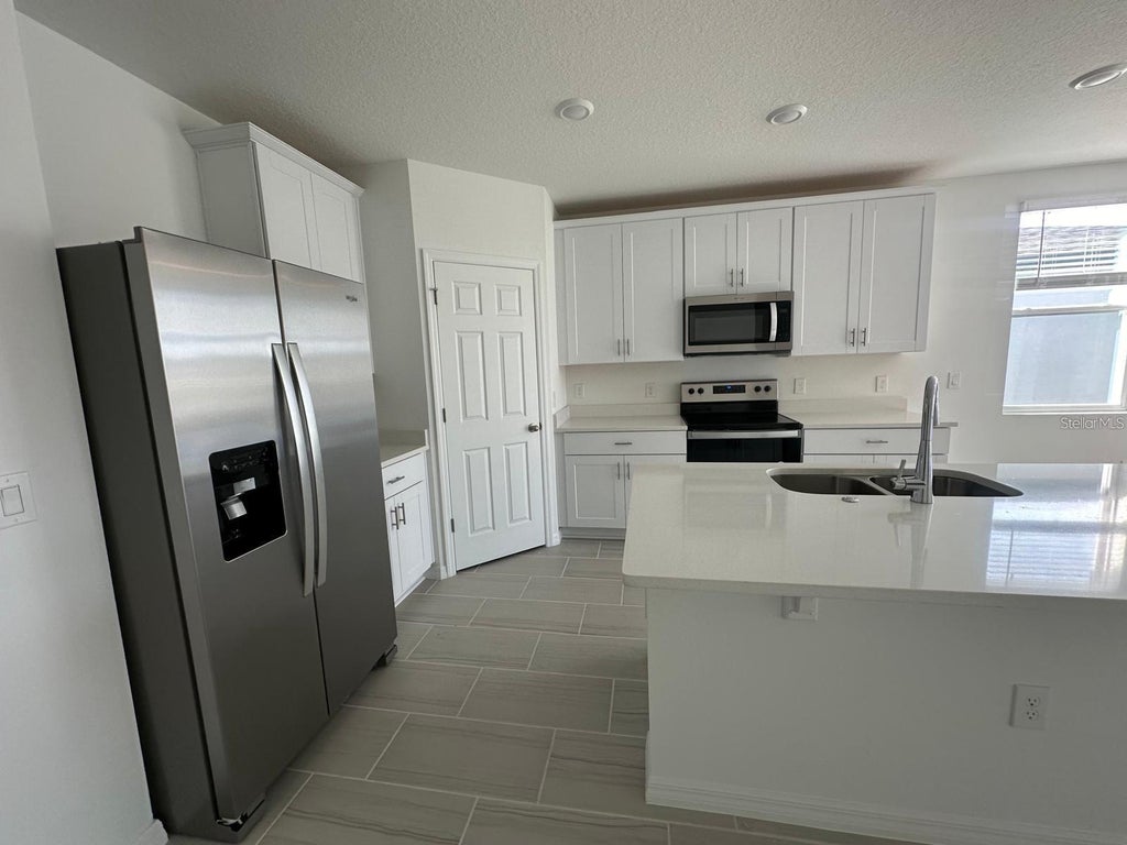 Photo of 2748 San Marco Way, Winter Haven, FL 33884 (MLS # O6413542)