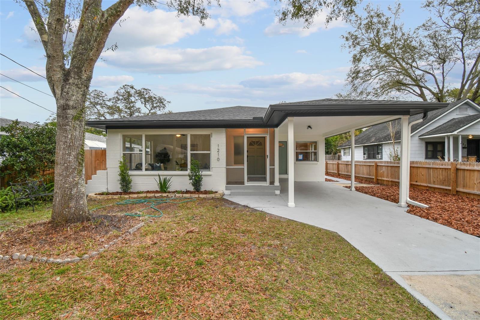 Welcome to your dream home in the heart of Seminole Heights. This 2-bedroom, 1-bathroom gem boasts 1,248 square feet of pure charm. Step inside and discover a world of stylish updates, from the luxury vinyl flooring to the sleek stainless steel appliances. The kitchen is a culinary haven, featuring solid stone countertops and a perfect blend of function and style. Picture yourself enjoying meals in the cozy kitchen dining room combo, surrounded by the warmth of good company and contemporary design. The living room welcomes you with large windows that flood the space with natural light, creating a vibrant and inviting atmosphere. And when you're ready to unwind, step outside onto the screened-in patio or deck – ideal spots for entertaining or simply relishing the enchanting Florida nights.
Doing laundry becomes a breeze in the indoor laundry room with its own pantry, adding a touch of convenience to your daily routine. Plus, this home isn't just a haven – it's a gateway to the local delights of Seminole Heights. Take a short stroll to Giddens Park and its adjacent dog park for some outdoor fun. Craving local flavors? Ella's Folk Art Cafe, Ebisu Sushi Shack, and Nebraska Mini Mart are just around the corner, offering a variety of culinary delights. Immerse yourself in the vibrant community and culture of Seminole Heights, all while being only a 12-minute drive from the bustling downtown Tampa scene. This home is more than a residence; it's an invitation to embrace the lighthearted and fun-filled lifestyle that Florida has to offer. Your new adventure awaits – welcome home! Roof 2024, Hot Water Heater 2024, AC/HVAC 2014.