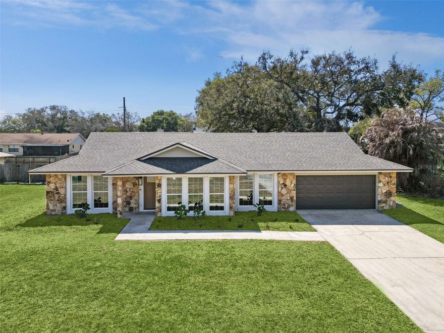 Your search is over! Welcome to this beautifully remodeled 4-bedroom, 2-bath home in desirable Belle Isle, just minutes from downtown Orlando. The home has been completely opened up to create a bright, modern layout that is perfect for both everyday living and entertaining. Enjoy a spacious living and dining area that flows seamlessly into a stunning oversized kitchen featuring all-new cabinetry, countertops, and fixtures. The interior laundry room is conveniently located between the kitchen and garage for added functionality. French doors on both sides of the fireplace lead to an expansive backyard with over 250 square feet of covered patio space, ideal for grilling, hosting gatherings, or simply enjoying the Florida weather. Recent updates include wood-look luxury vinyl flooring throughout, a fully renovated kitchen and bathrooms, new windows, a new roof, new HVAC system, new water heater, and a new fiberglass front door. The property also offers deeded access to Lake Conway, so bring your boat. Conveniently located near Orlando International Airport, major roadways, downtown Orlando, employers, restaurants, shopping, and schools, this home provides the perfect balance of accessibility and quiet neighborhood charm. Schedule your private showing today.