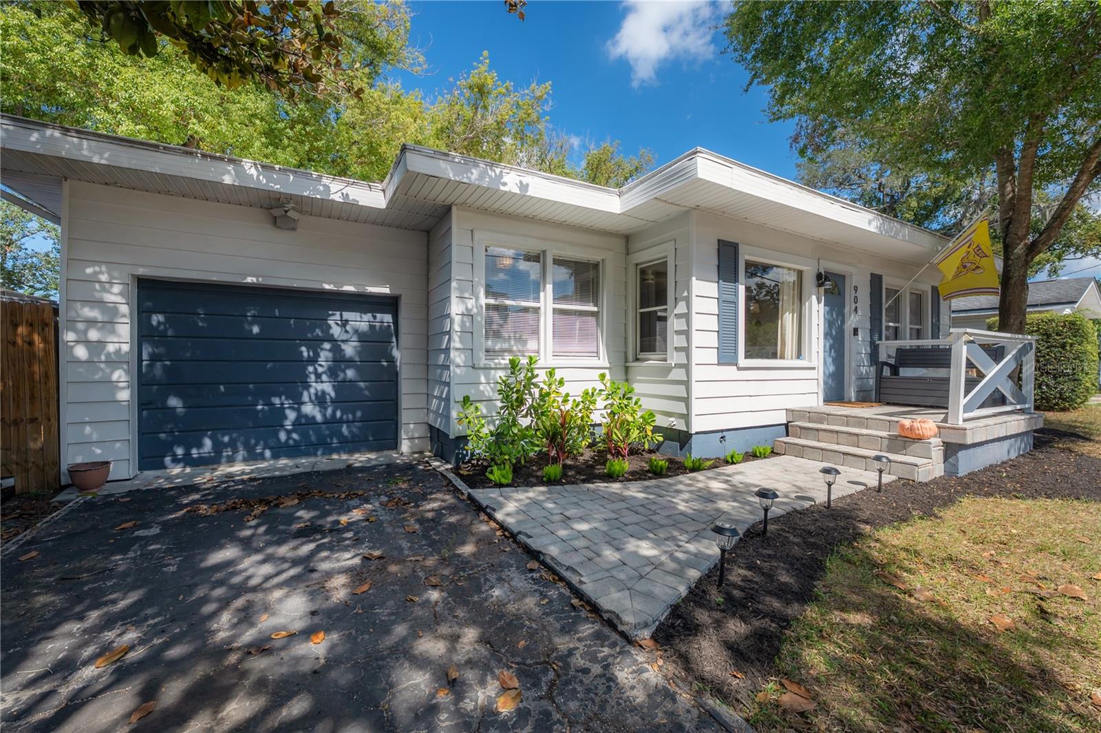 Welcome to The Knollwood Cottage in trendy Old Seminole Heights— where timeless Seminole Heights charm meets the energy of the ever-growing Nebraska corridor. Live just steps from local favorites like The Rollin Mullet, Gangchu, and Magnanimous Brewing, beautiful parks, new volleyball courts, and charming Lake Roberta, with even more exciting businesses continuing to pop up around you ALL the time.
A cottage built with all the charm of the 1950s, this home has been tastefully updated from top to bottom, including a newer roof, HVAC, plumbing, electrical, kitchen, and bathrooms. Step inside and take in the abundant natural light (you'll adore the picture window in the living room), thoughtful updates, and surprising functionality throughout. The split floor plan offers ideal privacy and separation while still maintaining an inviting flow that’s perfect for both everyday living and entertaining. The spacious primary suite is a rare find in homes of this era, featuring a large walk-in closet and an attached bonus room that makes an ideal home office, nursery, dressing room, reading nook, or workout space. Modern touches like built-in Bluetooth speakers in both bathrooms and a touch-free kitchen faucet add convenience, while the kitchen’s generous cabinet space and built-in wine fridge bring a touch of luxury. Toward the back of the home, a dedicated laundry room provides extra storage — another rarity in 1950s homes — and leads to the screened lanai overlooking the large, fully fenced backyard. There’s plenty of room for a pool, garden, or your favorite weekend activities, making this the perfect place to relax, unwind, and truly enjoy life in the Heights.
Tastefully remodeled with style and practicality in mind, this home offers the best of both worlds: historic charm and modern convenience, right in the heart of highly desirable Old Seminole Heights.