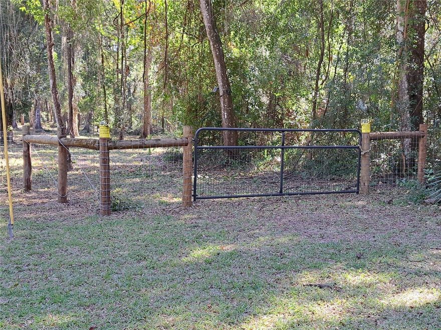 Nature lovers' paradise. Wildlife is abundant along with one hundred-year-old plus oak trees that dot the property. The property is also partially fenced and cleared. Access is from a county designated scenic roadway. The University of Florida campus is approximately 3.6 miles away, 9 minutes via US 441 (13th Street). No HOA.