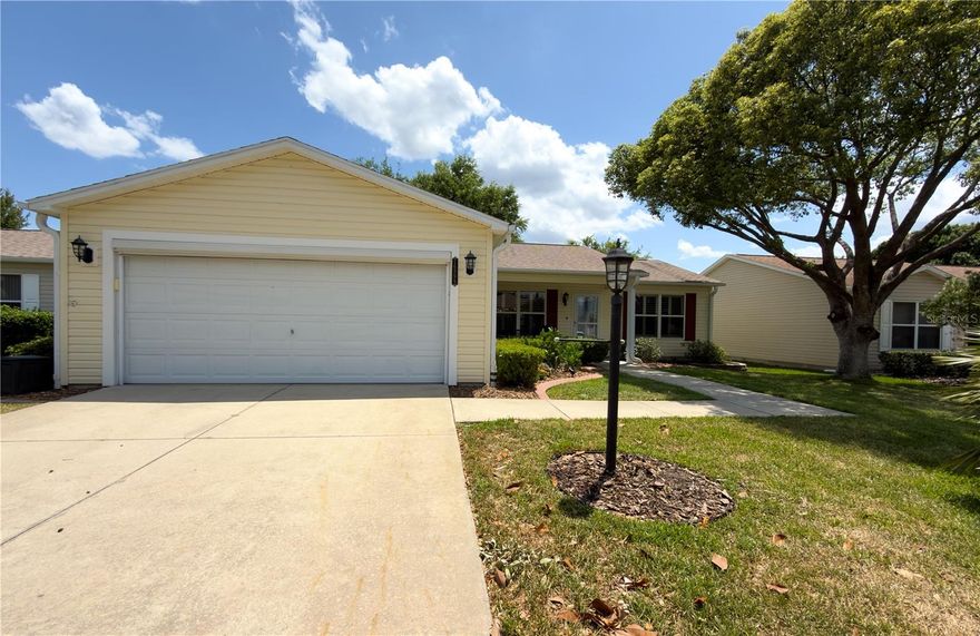 Welcome to this beautifully maintained Abilene model in The Villages offering the perfect combination of comfort, style, and location — now offered at ONLY $289,000 with the BOND PAID! This FURNISHED, TURNKEY 2-bedroom, 2-bath split floor plan home features a spacious 2-car garage and is ideal for full-time living, seasonal use, or investment opportunities in one of Florida’s most sought-after active adult communities.

From the moment you arrive, you’ll appreciate the lush tropical landscaping, charming front patio, and elegant leaded-glass front door that create incredible curb appeal. Inside, the bright open-concept layout showcases LUXURY VYNIL PLANK (LVP) flooring throughout the main living areas, TILE flooring in the bathrooms, PLANTATION SHUTTERS, and NO CARPET for easy maintenance and modern Florida living.

The thoughtfully designed split-bedroom floor plan provides privacy for both owners and guests. The spacious kitchen is loaded with upgrades including stainless steel appliances, a gas range, beautiful wood cabinetry, decorative tile backsplash, and a farmhouse sink perfect for entertaining or everyday convenience.

One of the standout features of this home is the enclosed air-conditioned Florida room, creating additional year-round living space ideal for relaxing, reading, or hosting guests. Step outside to the oversized 15’ x 27’ screened birdcage patio surrounded by mature landscaping that offers both privacy and a peaceful outdoor retreat.

Conveniently located near Mulberry Grove Plaza and Nancy Lopez Legacy Country Club, you’ll enjoy quick access to championship golf, shopping, restaurants, medical facilities, the VA hospital, recreation centers, swimming pools, and all the lifestyle amenities that make The Villages so desirable.

This move-in ready Florida home delivers incredible value, location, and lifestyle at an affordable price point. Schedule your private showing today before this opportunity is gone!

Staging decorations and staging accessories do not convey with the sale of the property.