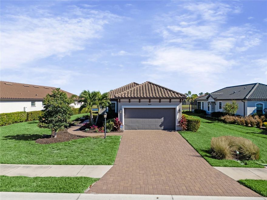 Huge PRICE REDUCTION! SHORT TERM SELLER FINANCING AVAILABLE!! Welcome to this exceptional deeded golf home in the gated Azario community, Enjoy Lock-and-Leave Luxury, Resort Lifestyle, & Waterview.
Perfect as a second home or seasonal retreat, offering just under 1,700 square feet of thoughtfully designed living space and over $125,000 in upgrades. Situated on an extra-large premium waterview lot, this 2-bedroom, 2-bath residence also features a den/office, separate living and dining areas, and an open floor plan ideal for both everyday living and entertaining.
The spacious kitchen showcases quartz countertops, soft-close cabinets and drawers, a built-out California Closets pantry, and abundant workspace. All-tile flooring, crown molding, pocket doors, and expansive three-panel sliding glass doors fill the home with natural light and create a seamless indoor-outdoor flow.
Step onto the east-facing lanai and enjoy serene water views, a fully equipped outdoor kitchen, removable Eze-Breeze panels for year-round comfort, and plenty of space to add a large pool and expanded outdoor living area.
Additional upgrades include Category 5 impact windows and lanai doors, custom California Closets in two rooms, blinds on all windows, designer fans, garden landscaping and lighting, gutters, and a custom laundry room with sink. The extended 4-foot garage features an epoxy floor, overhead storage rack, and smart garage door opener.
Azario offers a true resort lifestyle with a world-class 18-hole championship golf course, driving range and pro shop, tennis and pickleball courts, culinary center, clubhouse, lifestyle director, wellness spa, state-of-the-art fitness center, resort-style pools, Bahama Bar, dog park, and a wide variety of social clubs.
This is more than a home—it’s a lifestyle. A truly one-of-a-kind property in an extraordinary community you won’t want to miss.