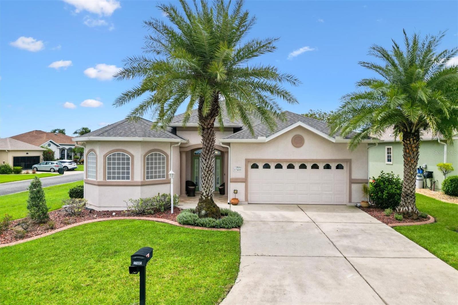 Located in the Exclusive 55+ Gated Golf Community of STONECREST, with all the amenities, adjacent to THE VILLAGES, Florida! Don’t miss this stunning Maple Model in The Meadows at Stonecrest. This well maintained home Features an OPEN FLOOR PLAN with high ceilings, a chef’s kitchen with stainless steel appliances, oversized breakfast bar, Reverse Osmosis System, and a cozy dining area. The Primary suite offers elegance and comfort with a tray ceiling, double walk-in closets, dual vanities, and a luxurious soaker tub. Enjoy versatile living spaces with a Florida room and screened Birdcage patio. Major updates include (2015) double-hung windows with transferrable warranty, NEW HVAC (2016), NEW ROOF (2024), INTERIOR PAINTED (2024), Solar tubes, MAJIC ELECTRIC ATTIC STAIRS in garage, In ceiling speakers, and more. Stonecrest residents enjoy world class amenities; four pools (one indoor, and one right across the street from this home), golf, pickleball, tennis, bocce, softball, dog park, fitness center, restaurant, and countless clubs. Shopping, dining, and medical facilities are just minutes away, accessible by golf cart. This move-in ready home has it all. Schedule your showing today!