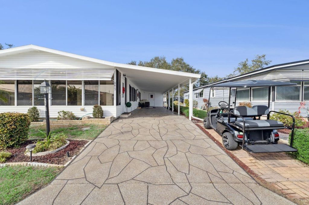 Photo of 6613 Westchester Drive NE, Winter Haven, FL 33881 (MLS # L4958824)