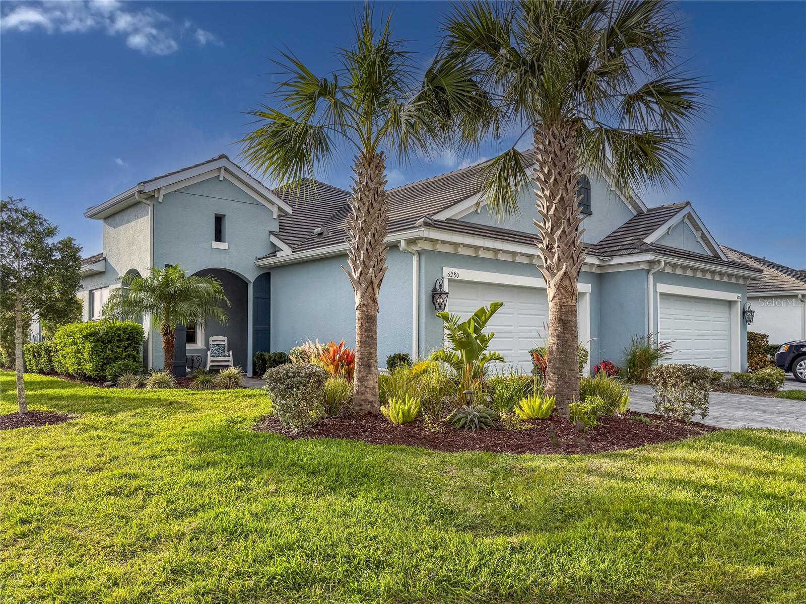 Welcome Home to Poinciana, a small gated boutique community ideally located between the beach, SRQ airport and UTC Mall! This 2 bedroom, 2 bathroom paired villa is a CORNER UNIT WITH NO NEIGHBOR ON ONE SIDE AND DOES NOT BACK TO THE ROAD. Enjoy your peaceful lanai with upgraded privacy screen, or stroll down to your resort style community pool, spa and picnic area. Upgraded finishes include ceramic tile floors in main living area and carpet in bedrooms, solid wood cabinetry, granite countertops, stainless steel appliances and neutral wall colors. Home is additionally equipped with a water softener. Kitchen offers OPEN FLOORPLAN with island for entertaining with ease. Two car garage, single floor living, LOW HOAs and NO CDD, with the amenities you can enjoy, make this a great place to call home. Book your appointment today!