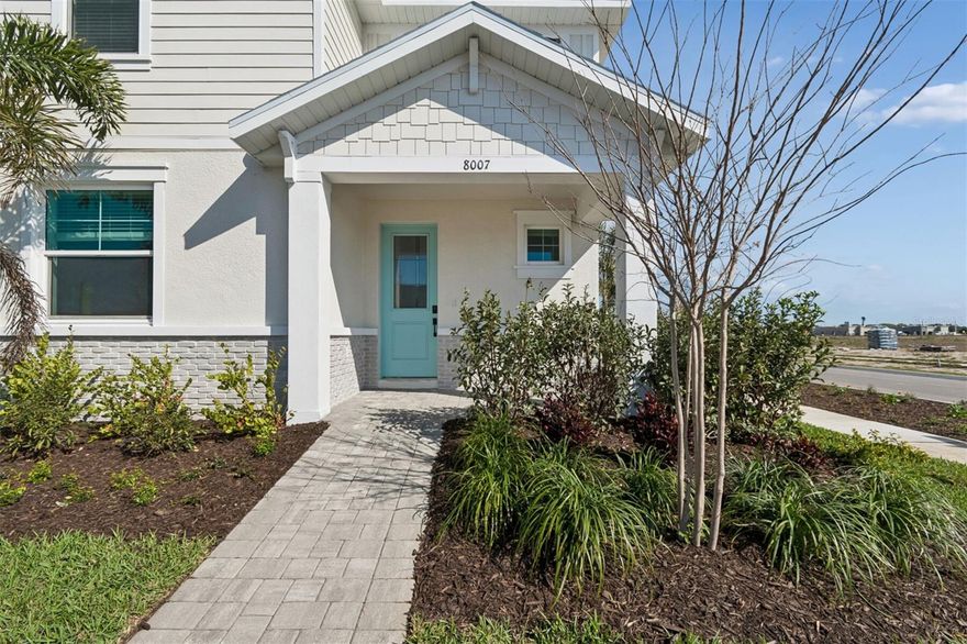 Ready NOW! End unit townhome 3 Full En-Suites, 2 car rear facing garage near the Beaches. Amazing! 2,406 square feet of thoughtfully planned living space with a modern open-concept floorplan that seamlessly connects the kitchen, dining, and great room—ideal for everyday living and entertaining. The kitchen features stylish cabinetry, stainless steel appliances, quartz counters, generous space, and a large center island overlooking the living area and covered lanai. The primary bedroom is located on the main level, complete with a walk-in closet and well-appointed en-suite bath with dual vanities. Upstairs, a spacious loft provides flexible living space, while two additional bedrooms each feature en-suite bathrooms and walk-in closets, making this layout ideal. Highlights include three full bathrooms, a powder room, a laundry room, and an attached 2-car garage. Located in West Bradenton, this low-maintenance community offers easy access to local parks, shopping, dining, and Gulf Coast beaches. Community features include a swimming pool, clubhouse, dog park, maintained grounds, and included internet service. With quality construction, energy-efficient features, and a prime location, this townhome delivers comfort, functionality, and modern Florida living.