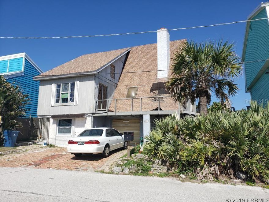Rare opportunity to purchase DIRECT oceanfront house with a rock revetment for $799,000 in beautiful Bethune Beach. House needs remodeling. There is a first floor mother-in-law apartment that has been remodeled.  A Frame 3 story. 300 ft to Intracoastal waterway system where you can launch a kayak or a canoe, You can launch a larger boat 3 miles south in the Canaveral National Seashore. One mile south is a public fishing dock, public tennis and public basketball. 20 ft walk to the white sand of this non driving beach-just out your door and down the stairs ;Water: City