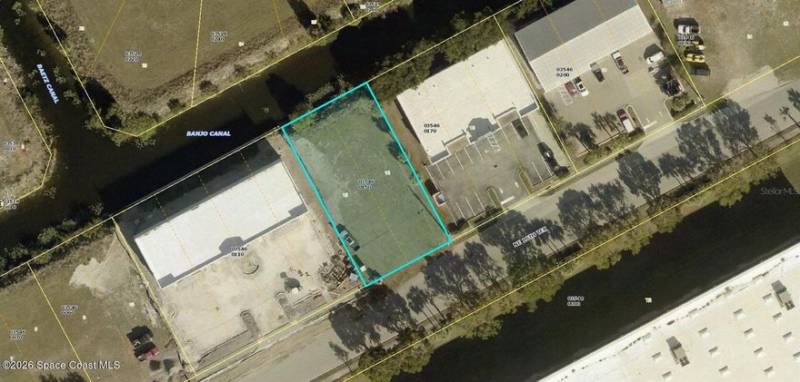 Commercial Building Site in the City of Cape Coral Florida.  Commercial Corridor Zoning!  Many commercial uses permitted.  Canal borders the back of the property.  Banjo Canal.  Some of the many commercial uses include Warehouse, Repair shop, Retail, Accessory Parking lots Craft Brewery, distilleries.   Self Storage m wireless communication facilities and many others.  Site is to grade and cleared.