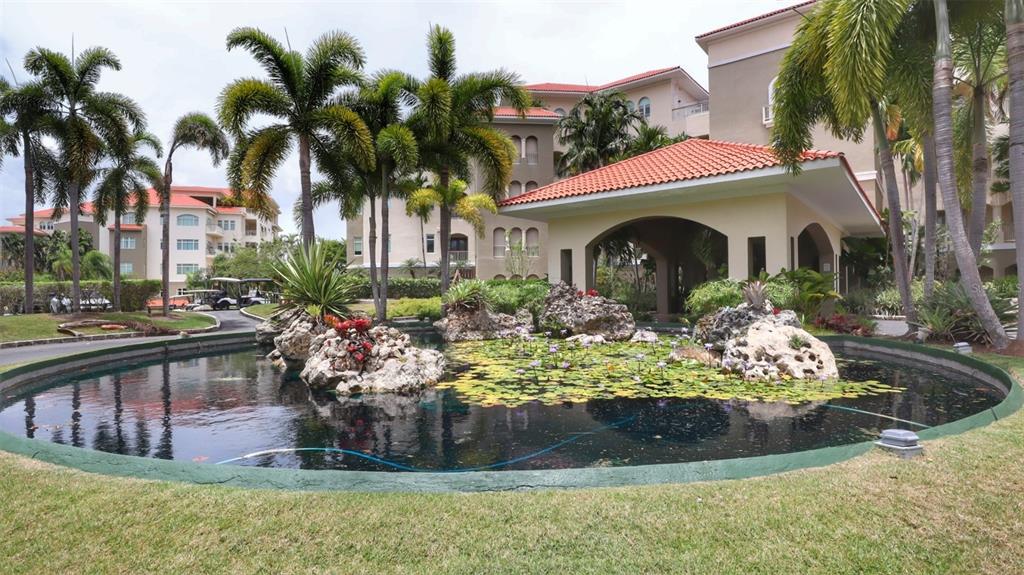 Featured with this garden apartment is an open floorplan with 1,885 sq ft approx. of interior living space, eat in kitchen, a spacious dining and living room that lead to a combination of covered and open terraces of 650 sq. ft. approx. with lush landscape that overlooks the golf course, lakes and the mountains.
The impeccable, just fully renovated kitchen offers an elegant center island with quartz countertop and high-end stainless-steel appliances, including an induction cooktop, that opens up to a relaxing and luxurious living/dining room area.
The property also offers 3 ensuite bedrooms, laundry room and a just remodeled powder room.
The principal bedroom has 2 walk-in closets and bathroom with soaking tub and shower.
OWNER ACCEPTS CRYPTO
This unit has just been professionally decorated and it has superb finishes. It comes fully furnished and equipped with top-of-the-line pieces from Mitchell Gold and Roche Bobbois.
The sale also includes a golf cart, an indoor golf cart parking spot, private oversized 2 car garage with storage space and three additional assigned outdoor parking.
The building has full building capacity emergency generator and water systems, 24-hour onsite surveillance and security.
Plantation Village is a private gated neighborhood within the grounds of Dorado Beach Golf Club. It is located just minutes away from fine dining, state of the art fitness and tennis facilities and the amazing Watermill Waterpark. A short golf cart ride on private paths will take you to the iconic Ritz Carlton Reserve, Encanto Beach Club, and Spa Botanico. A residential dream or investment property can be yours, call now for more info or to make an appointment.