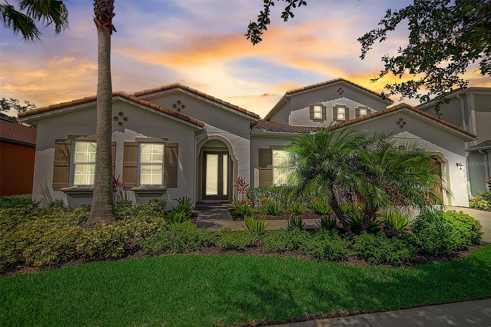 One or more photo(s) has been virtually staged. Here it is, your fantastic newer built home in lovely, gated, Promenade at Lake Park in Lutz! Ideal location and highly sought after schools, including Steinbrenner High School! This wonderful home features a lovely in ground pool! Large main level floor plan for one level living. Huge second story second family room with full bath and closet could be used a 5th bedroom. Gorgeous open floorplan kitchen featuring an enormous quartz island, tons of shaker style cabinets, extra counter space, tile backsplash, double oven, stainless steel appliances and full size, eat-in space. Main family room opens to large heated pool, with spa and bird-cage screening. Home backs to nature, so no neighbors in the rear. Upgraded finishes throughout, including extra large primary suite with tray ceiling, large primary bath with dual sinks, extra large stand-up shower and large soaker tub. Extra large office with glass doors. 3 car tandem garage. Heated pool features spa and upgraded Travertine pool deck. Paver stone driveway. Close to Dale Mabry, airport, and shopping and entertainment galore! Come get it before it's gone!