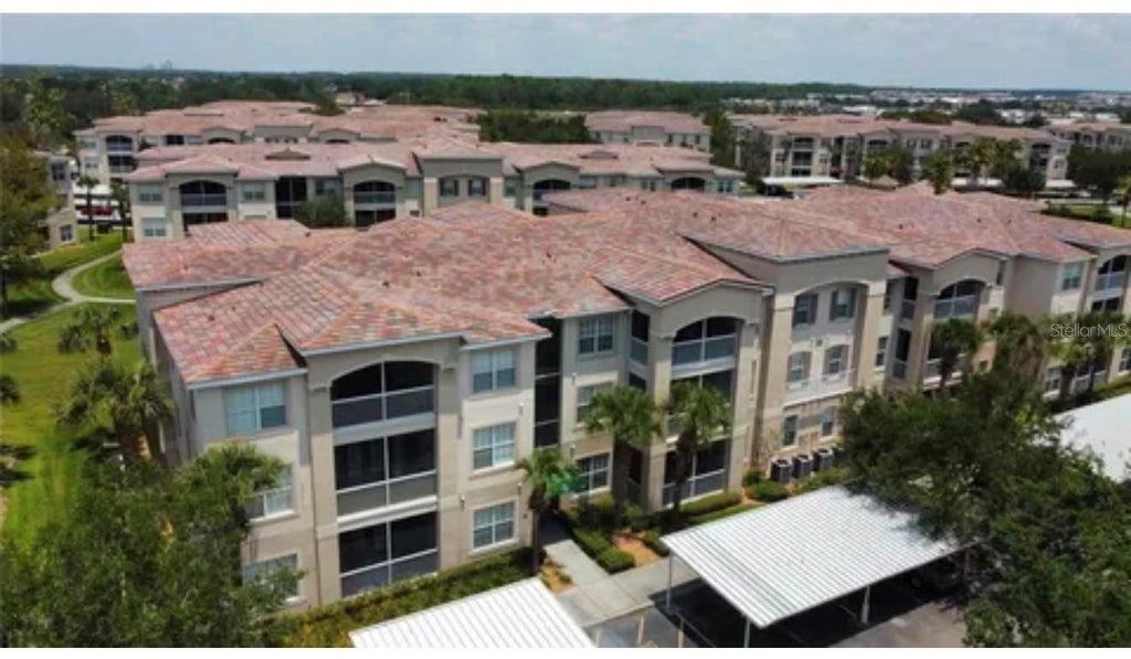 Photo of 3001 Greystone Loop #102, Kissimmee, FL 34741 (MLS # O6436175)