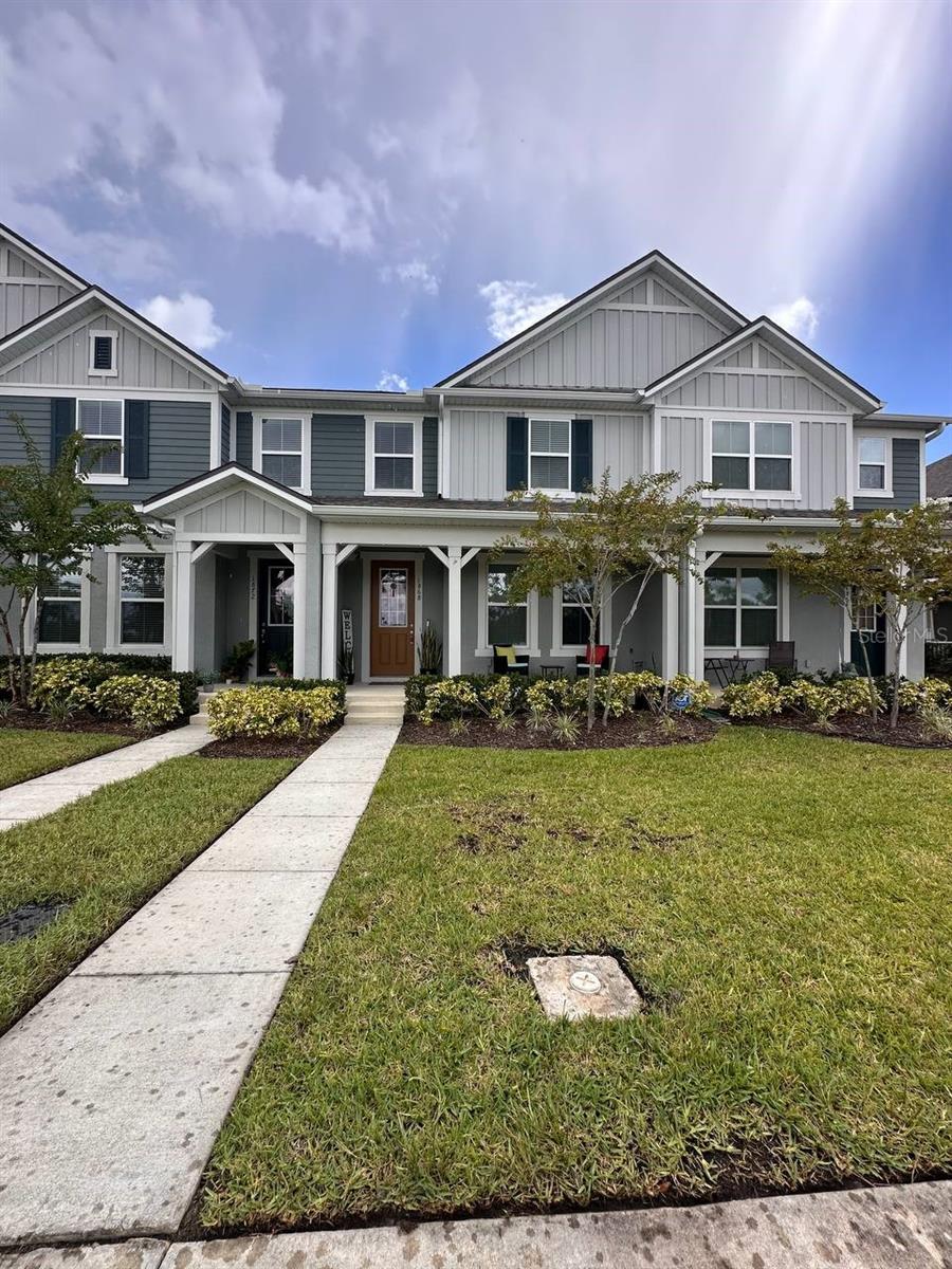 This 3-bedroom, 2.5-bath townhouse in Kissimmee's desirable Cross Prairie community offers an open-concept layout with tile floors downstairs and plush carpet upstairs, a spacious living area, and a modern kitchen with white cabinetry, quartz countertops, large island with breakfast bar, stainless steel appliances, and stylish tile backsplash. Upstairs features generously sized bedrooms, including a primary suite with a private ensuite featuring a double vanity, glass-enclosed shower, and walk-in closet. There’s also a versatile loft area with sliding doors to a covered balcony overlooking the neighborhood. Community amenities include a resort-style pool, clubhouse, fitness center, tennis courts, playgrounds, and scenic walking/biking trails. Conveniently located near NeoCity, schools, shopping, dining, and major highways for an easy commute to Orlando International Airport, Downtown Orlando, and theme parks. This move-in ready home offers comfort, convenience, and style—schedule your showing today.