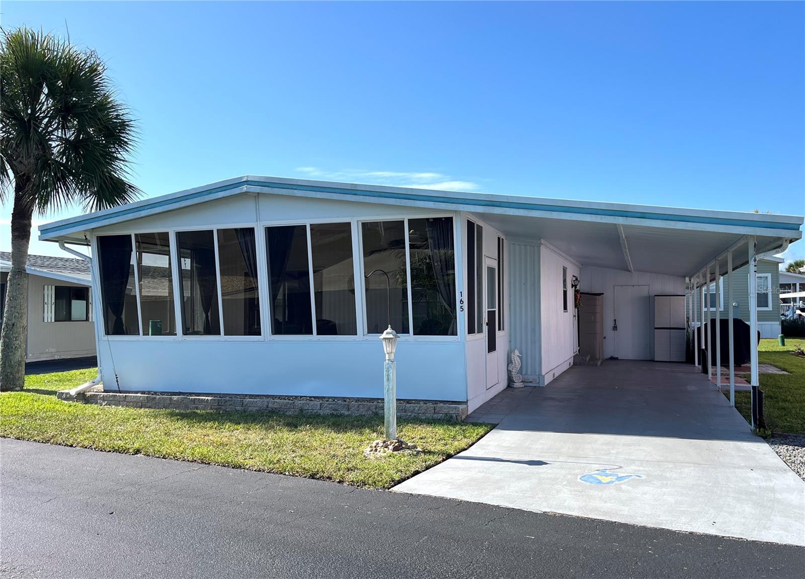 Move in ready 2bed/2bath Bungalow at the Beach! This home has been updated so you will not have to do anything except move in and start enjoying the Beach Life! This home has an open floorplan, new kitchen with newer appliances and luxury flooring. Both bedrooms are very spacious, with plenty of storage, and both bathrooms have walk in showers. This home offers a large enclosed front porch adding quite a bit of entertaining space to the home. There is a long driveway with room for 2 cars, golf cart parking and a large storage room with built in cabinets. Surfside Estates, an active 55+ Manufactured Home Community that is nestled between the Atlantic Ocean and the Intracoastal Waterway. Surfside Estates is a Resident Owned land share Community which means there is no lot rent! When you purchase your home in Surfside Estates you own a share of this beautiful beachside community. The monthly maintenance fee is $180/month and includes wi-fi, internet, cable, yard maintenance, management and use of all the facilities. There is an inground heated/cooled pool, fitness room, library, shuffleboard court and rooftop deck. The Social Club offers many activities to get involved as much or as little as you like. Friday night bingo, men's and lady's cards, pool tables and large screen TV for all your sporting events. Exercise classes and water aerobics. Walk to the beach across the street or ride your bike or golf cart to one of the 2 docks to enjoy fishing or just relax and enjoy the sunsets and the boats and dolphins go by. There is kayak storage, a BBQ Pit and gazebo with a view of the Intracoastal. The quaint neighboring town of Flagler Beach is just a few minutes down the road, where you will find a variety of shops and restaurants to choose from. Just over the bridge you will find shopping, restaurants, hospitals and doctors. What are you waiting for? Time to start planning on getting out of the cold and start enjoying the salt life today! Home is in probate, and will have a delayed closing.