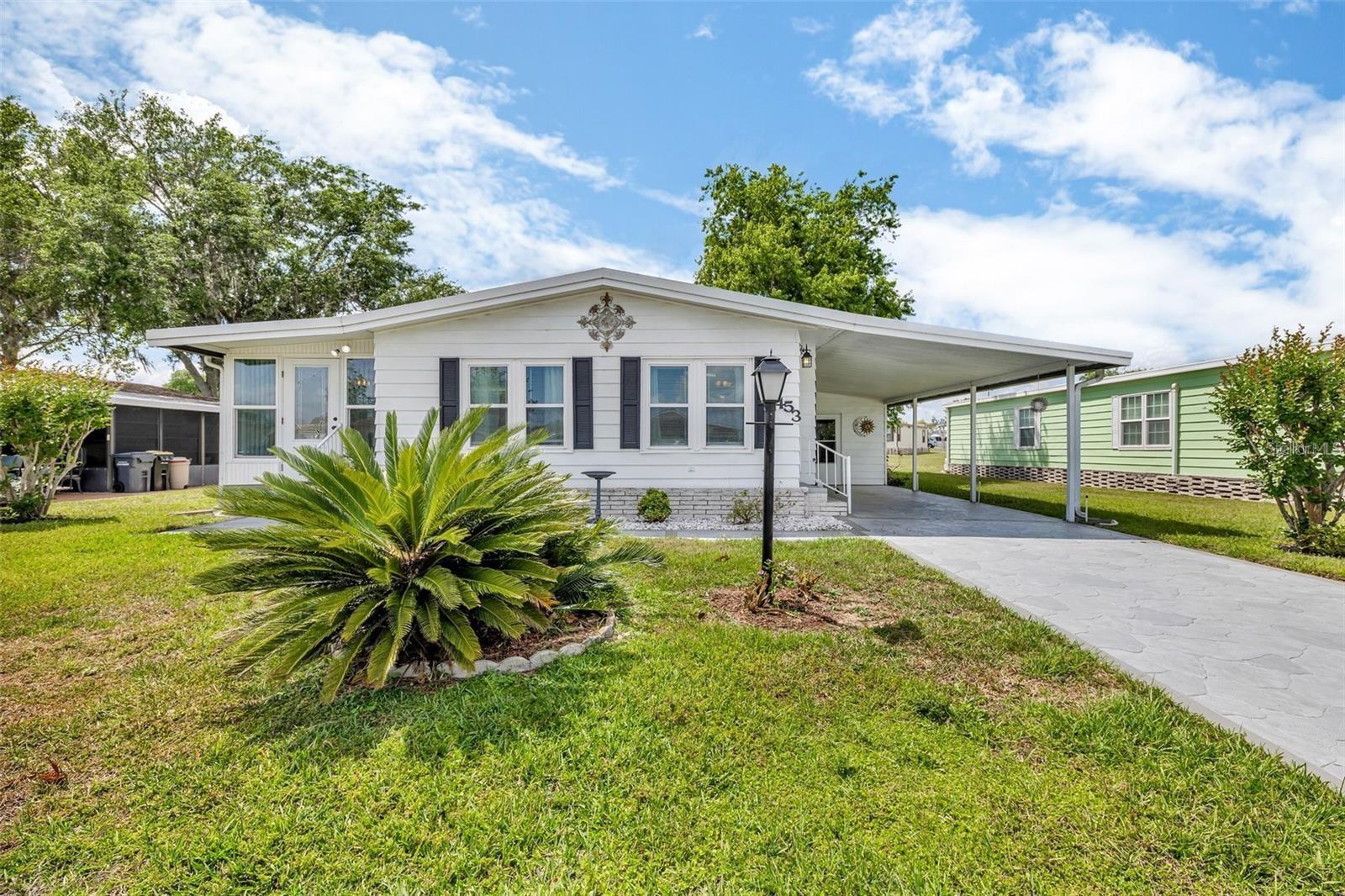 Welcome to Polo Park, a lively 55+ community conveniently located off US-27 in growing Davenport, where you own the land. This two-bedroom, two-bathroom manufactured home has been beautifully updated and is perfect for enjoying the Florida lifestyle. Step inside and be impressed by the open-concept floor plan, flooded with natural light. Recent improvements include a updated kitchen (2020), a new Florida Room (2019), 12 new energy-efficient windows (2018), a new roof (2018), and a new air conditioner (2016). Polo Park offers a full suite of amenities to keep you active and engaged. For just $180 per quarter, residents can enjoy access to two heated community pools, two clubhouses, shuffleboard courts, pickleball, horseshoes, tennis, and bocce. Additionally, Polo Park features a 9-hole executive golf course right in the community! Finally, this volunteer-driven community offers a wide range of daily activities. Conveniently located near Disney, shopping, dining, and local attractions, it's hard to get bored as a Polo Park resident! Come see why Polo Park is the perfect place to call home. Don't wait! Schedule your private tour today!