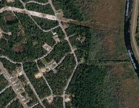 Photo of Tbd SE Sequoia Loop, Ocklawaha, FL 32179 (MLS # OM726283)