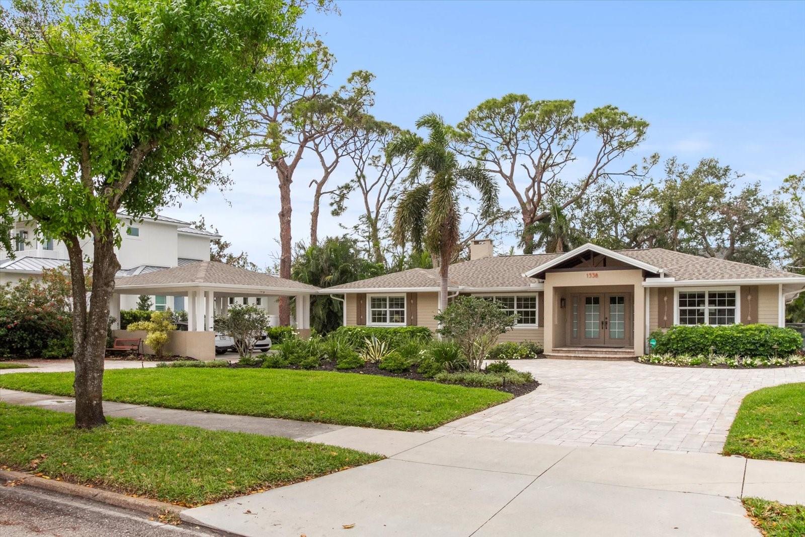 Dramatic Price Reduction – Move-In Ready Furnished Home in Harbor Acres. Don’t miss this rare opportunity in one of Sarasota’s most sought-after neighborhoods. This beautifully revitalized, single-level 3BR/4BA home offers 2,551 sq. ft. of fully furnished living space and is priced to sell. Highlights include a 750 sq. ft. primary suite addition (2016) built to Miami-Dade hurricane code, with dual walk-in closets, separate his and hers bathrooms, and premium finishes. The home features refurbished oak floors, granite countertops throughout, modern lighting and plumbing fixtures, new appliances, and a whole-house speaker and security system. Enjoy indoor-outdoor living with a 426 sq. ft. screened-in porch, ideal for entertaining. Exterior upgrades include a custom water feature, paver circular driveway, dramatic landscape lighting, and a water well-fed sprinkler system. Additional Features: • New roof (2022) • Two-car solid structure carport with extra parking • No elevators or shared parking—total privacy and convenience • Beautiful mature landscaping. A perfect balance of size, style, and location—this home is truly one of a kind. Schedule your showing today!