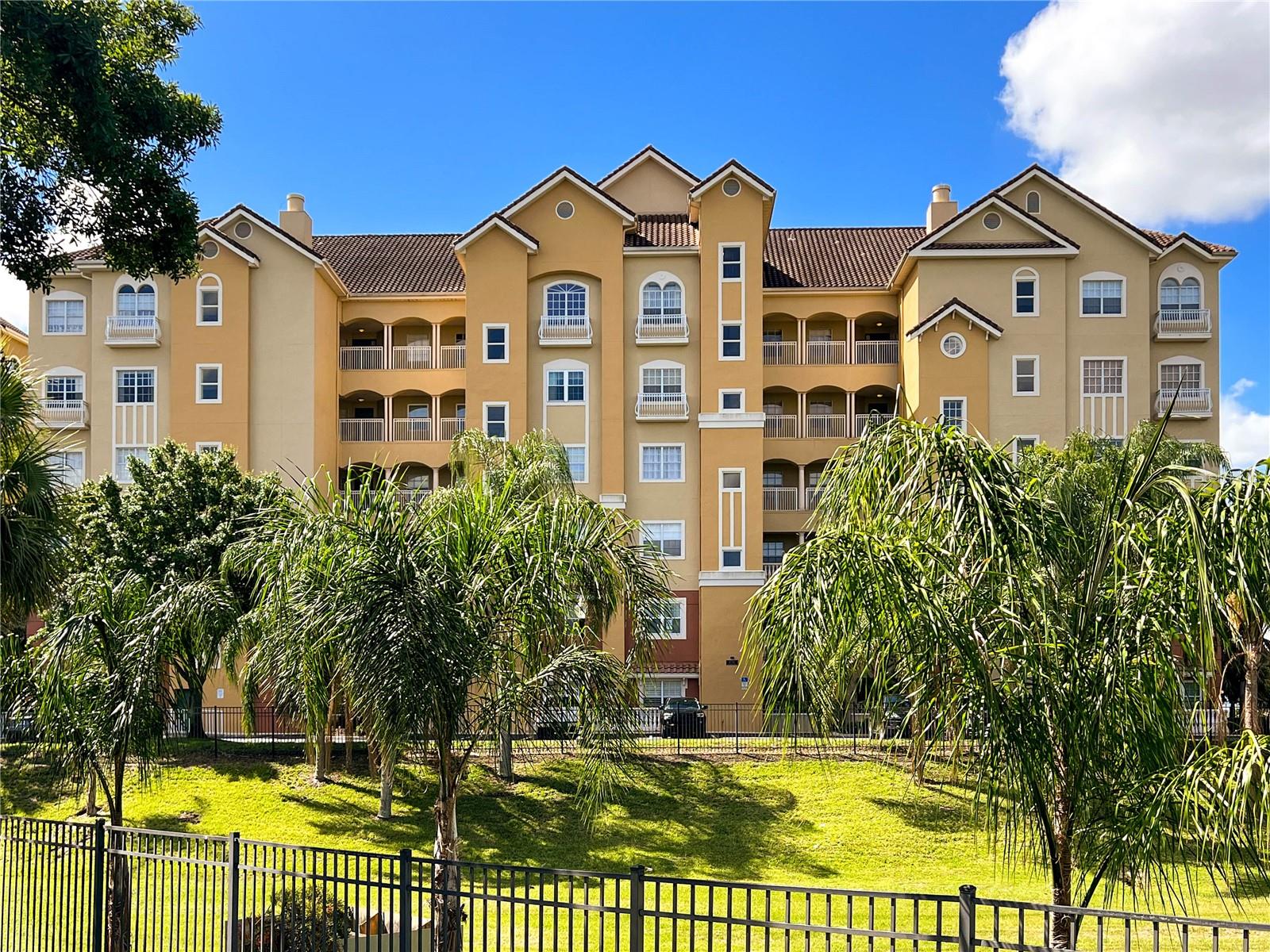 Welcome to luxury lakefront living at Vizcaya! This 2-bedroom, 2-bath condo is perched on the 3rd floor and offers breathtaking views of Big Sand Lake right from the balcony, complete with a motorized screen for year-round enjoyment. Inside, high ceilings, crown molding, tile floors, and plantation shutters set a sophisticated tone. The updated kitchen is a chef’s delight, featuring modern-style cabinetry, stainless steel appliances, convection ovens, built-in microwave, and a charming breakfast nook with a passthrough to the spacious great room. The formal dining area is accented by a stylish modern light fixture and flows seamlessly into the living room and out to the balcony overlooking the water. The primary suite is a retreat of its own with a tray ceiling, balcony access, a large custom walk-in closet, and a spa-like bath complete with dual vanities, soaking tub, glass-enclosed shower, and private water closet. The secondary bedroom offers generous space with a deep closet and convenient access to the second full bath. A well-appointed laundry room adds function with built-in cabinetry, wood shelving, and a utility sink. This rental includes one assigned garage space under the building, an additional outdoor parking spot, and a storage unit. Community amenities include a fitness center, lakefront pool, and tennis courts. Perfectly located, you’re just a short stroll to Restaurant Row and minutes from world-class shopping, attractions, and the airport—all within the security of a 24-hour guard-gated entrance.