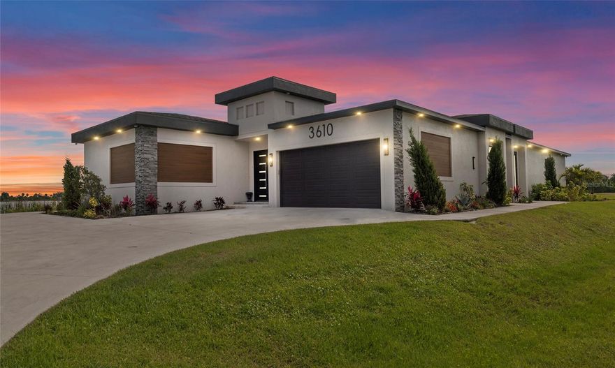 Experience Modern Luxury with Breathtaking Lake View in Lost River Preserve. Step into this stunning, modern design residence boasting 3-bedrooms,  3- bathrooms and 3-car garage Lakefront property It's about more than just owning a home; it's about owning a lifestyle that truly nourishes your soul.  Home offers a combined indoor/outdoor living are of 4430 sq ft  perfect for entertaining. Every  detail has been meticulously crafted with all custom finishes throughout, creating an atmosphere of Comfort and luxury.Imagine unwinding in your private courtyard, offering serene views that stretch across the tranquil lake. This outdoor oasis is perfect for morning coffee or evening relaxation.Inside, the home features a dream kitchen, smart stainless steal appliances ,modern light fixtures, water filtration system and a   huge pantry, providing ample storage for even the most enthusiastic cook. The open floor plan seamlessly connects the living spaces, creating an airy and inviting ambiance.Admire the  details, including the elegant refined crown molding and tray ceilings. The heart of the home is the expansive kitchen/family room combo, ideal for entertaining and everyday living. Surround sound in the living room area ,  electric fireplace , clear sliding glass doors leading into the pool courtyard. An extra den/office, with views overlooking the sparkling pool, offers a versatile space for work or relaxation. Enjoy modern convenience with  the ease of a smart home system at the palm of your hands.  This exceptional property offers a unique blend of modern luxury, thoughtful design, Inside, you'll find a blend of stylish ceramic tile and plush carpet flooring,  quartz countertops throughout offering both beauty and comfort.The property also features an additional garage {3rd garage} that presents a unique opportunity – it's already plumbed and ready to be converted into a private in-law suite, offering flexibility for multi-generational living or guest accommodations.The stunning master suite showcasing plenty natural light , tray ceiling and a  den area/office space. The luxurious ensuite master bathroom provides a private sanctuary, complete with dual vanities, spa style shower and separate  restroom area Outdoor living offers space for an outdoor kitchen, already plumbed for your convenience. The super quiet atmosphere ensures peace and tranquility, making this a true retreat.  Find your daily joy through simple pleasures like watching the water, feeling the breeze, or taking a boat ride.Connected to nature and the rhythms of the water. Come build your private boat dock and enjoy. Book your private tour.