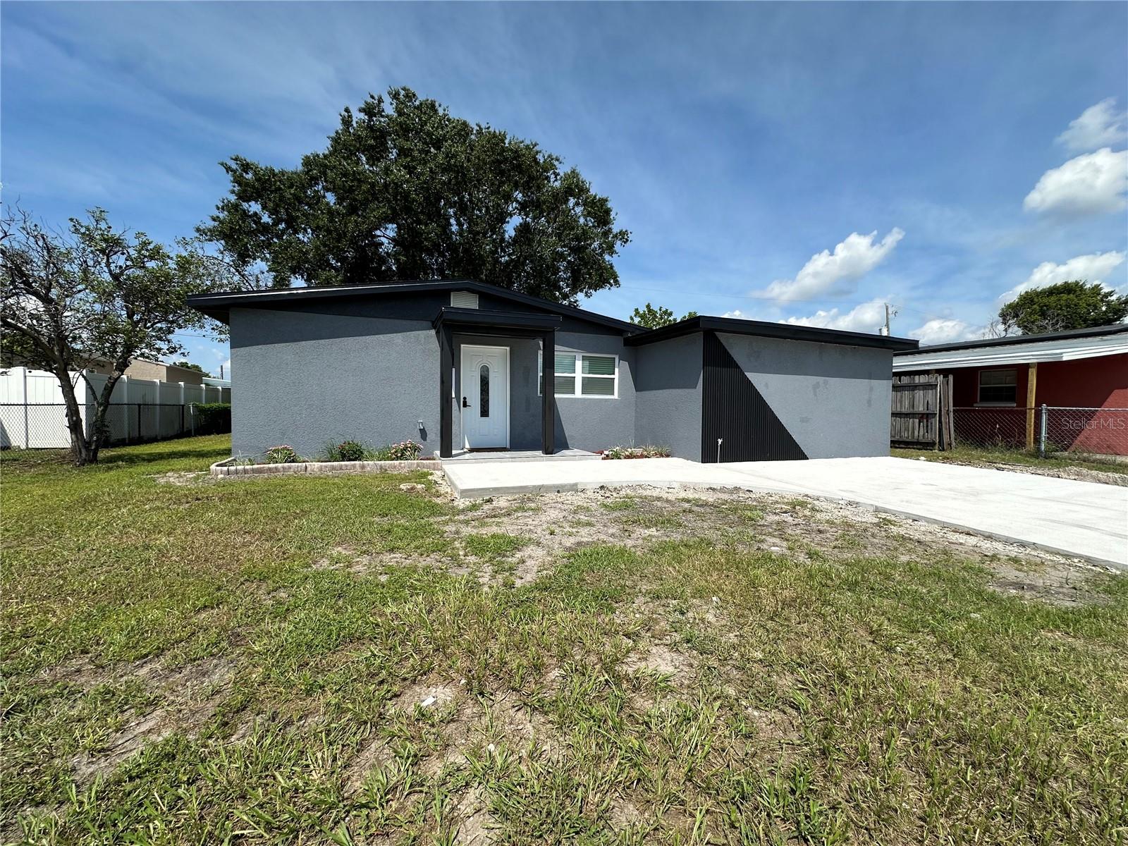 Fully renovated and move-in ready! This stunning 4BR/2BA home offers nearly 1,200 sq ft of modern living in the heart of Tampa. Enjoy a brand-new kitchen with sleek finishes, beautifully updated bathrooms, and elegant porcelain tile floors throughout. The exterior shines with fresh stucco, new windows, and stylish doors. Peace of mind comes with a 2021 A/C and a roof approx. 10 years old. Ideally located just 8 minutes to Tampa International Airport, 18 minutes to Downtown Tampa, and 35 minutes to Clearwater Beach. With four spacious bedrooms, this home is perfect for families, guests, or a home office. Close to shopping, dining, and major highways, this property combines comfort, style, and convenience—don’t miss it!