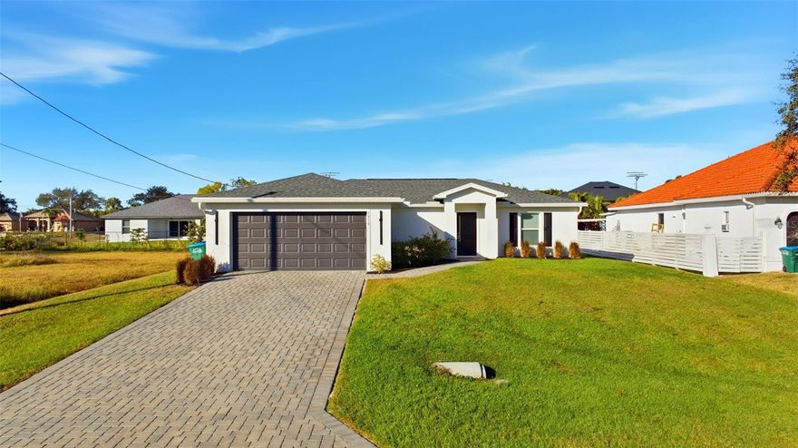 Charming 2024 Cape Coral Gem – No Flood Insurance Required!

Welcome to your brand-new haven in Cape Coral! This immaculate 3-bedroom, 2-bath home, built in 2024, offers a well-sized and thoughtfully designed living space with a modern split floor plan and elegant plank tile flooring throughout.

Situated in a prime location near a public golf course, this home is a rare find because it's completely outside the flood zone, thanks to a LOMR. That means no flood insurance is required, offering you peace of mind and savings.

Inside, you'll find a spacious and inviting living area illuminated by LED can lighting throughout. The primary bedroom features a beautiful accent wall, and the entire home is equipped with impact-resistant windows for added safety and energy efficiency.

The kitchen is a true centerpiece, boasting quartz countertops, 36-inch contemporary shaker-style cabinets, a subway tile backsplash in a herringbone pattern, and a generously sized island with a sink. All the appliances are Whirlpool and less than two years old. Additionally, the home has an irrigation system off the well to keep the landscaping lush and green.

Step outside to the extended back paver patio and enjoy the under-truss seating area, complete with a pizza oven—ideal for outdoor gatherings. The long, pavered driveway leads to a garage with an epoxy floor, adding both style and durability. Every inch of this home, inside and out, has been meticulously maintained, and the landscaping is in pristine condition.

With all these features in a great location and the bonus of no required flood insurance, this home is truly a standout.