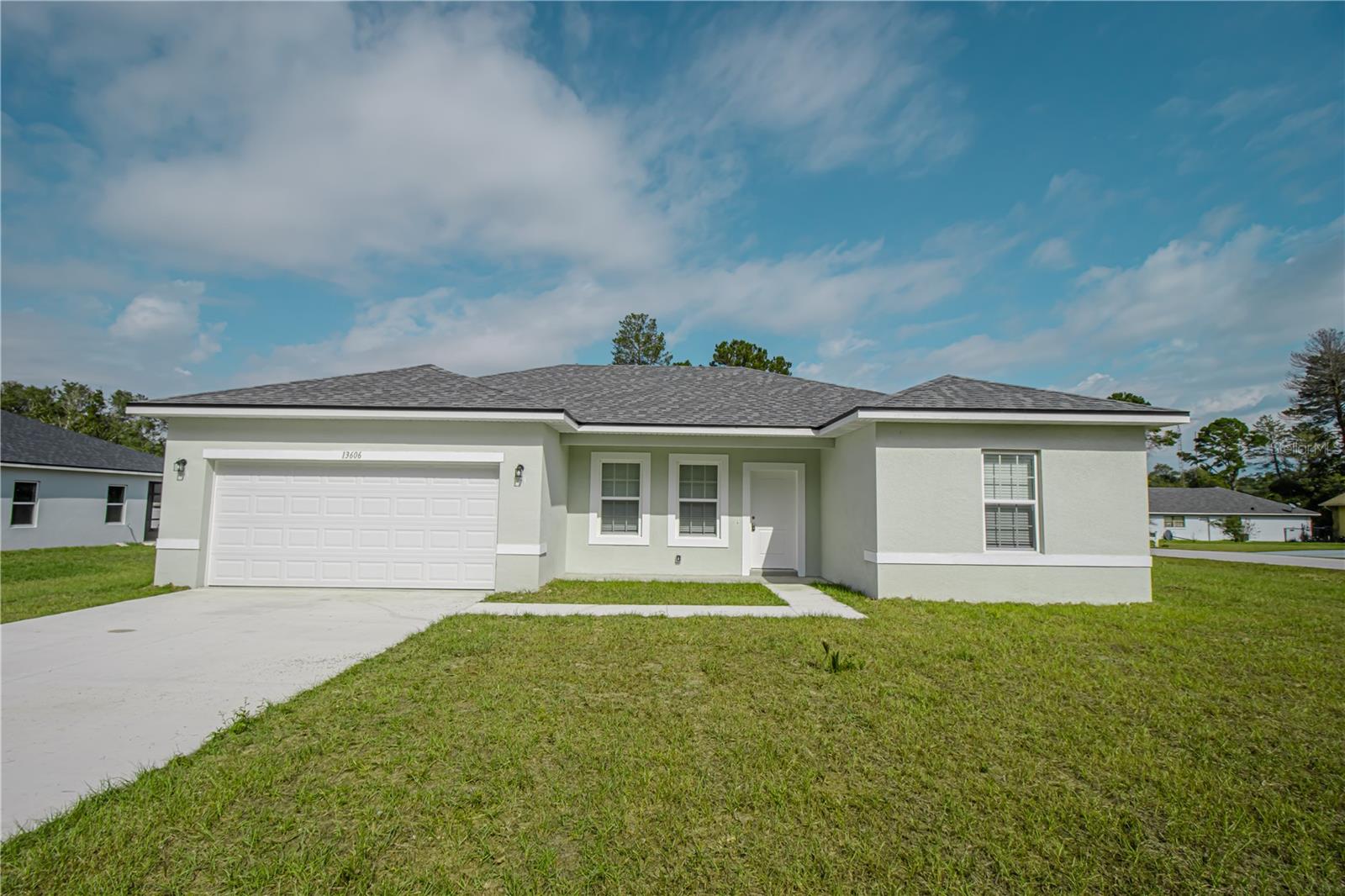 One or more photo(s) has been virtually staged. This brand-new house is a wonderful opportunity to live or invest in Ocala! Built in a very well-located lot, this home offers a modern style with 4 comfortable bedrooms and 2 bathrooms, a spacious open floorplan where you can host big family gatherings and a complete kitchen with all stainless-steel appliances including range, refrigerator, disposal, dishwasher and microwave, an island and great cabinet space. There are beautiful granite countertops in the kitchen as well as in the bathrooms, and tile flooring installed in all the rooms and living space, great for easy maintenance. Schedule your visit today!