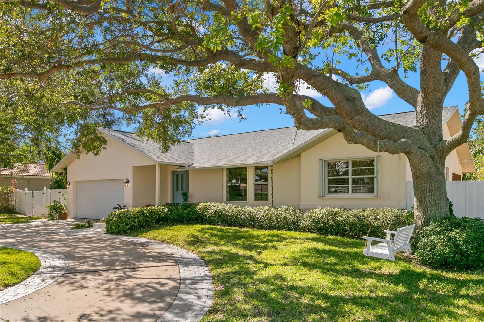 When you Dream of having a home in Florida, do you dream in Black and White? No, of course not! This Tierra Verde Pool Home brings those Technicolor Dreams to reality with Bold Stripes and Tropical Prints, deep hues of Pinks and Blues, layered in Texture and Sunlight. Located on a quiet street, the front of this well-maintained home is shaded by oaks, creating a warm and welcoming appeal. The foyer introduces shades of blue through the living room or game room, with the kitchen at the center of two dining spaces. This updated chef space has white shaker cabinets, cool quartz countertops, and a warm butcher block island. Serve guests at the kitchen island, the breakfast nook, the dining room or poolside with three sets of French doors leading to the pool and lanai. The split bedroom plan lends privacy to residents and guests. The primary suite has plenty of room for a sitting area or home office space, walk-in closet and ensuite bath. The second and third bedrooms share an updated bath with a glass enclosed tiled shower. You can also access this stylish bath from the pool and lanai. The free form pool is stunning, wrapped in natural stone and Florida native plants, creating a vacation vibe in your own backyard. The large lot lends space for a firepit, lawn games and pets. A long list of updates includes a new roof in 2024. Kitchen cabinets, countertops and appliances, AC, flooring, guest bath and pool equipment all new in 2022. Located in the southern tip of Pinellas County, Tierra Verde offers a multitude of activities for the outdoor enthusiast, nearby shopping and dining in Tierra Verde and Isla Del Sol, a quick ten minute trip to the gorgeous Gulf Beaches or Chic Downtown St. Petersburg museums and restaurants, as well as easy access to the interstate and airports. This home and neighborhood weathered the storms well without any flooding!