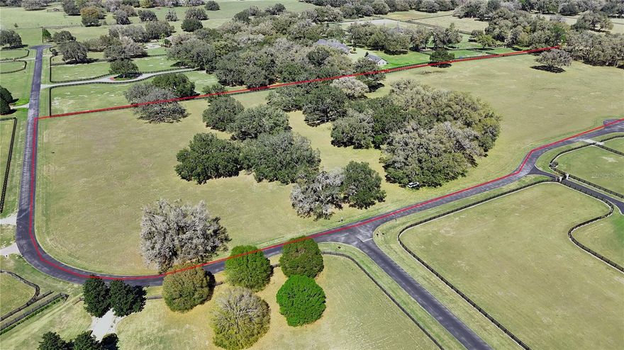 Are you looking to build your dream home or farm amidst beautiful Granddaddy Oaks? This is one of the prettiest lots in Equine Estates, with majestic Granddaddy Oak trees showering the property.   20.12 +/- Acres with the ability to ride to the Florida Greenways and Trails, plus close to the Florida Horse Park.   It's a short 20-minute drive to WEC.   This is a great spot to build your dream home or farm.  Equine Estates is a gated community with bridle trails and requires a minimum of 3,000 SF of living area.  This is one of the last lots available in the community.