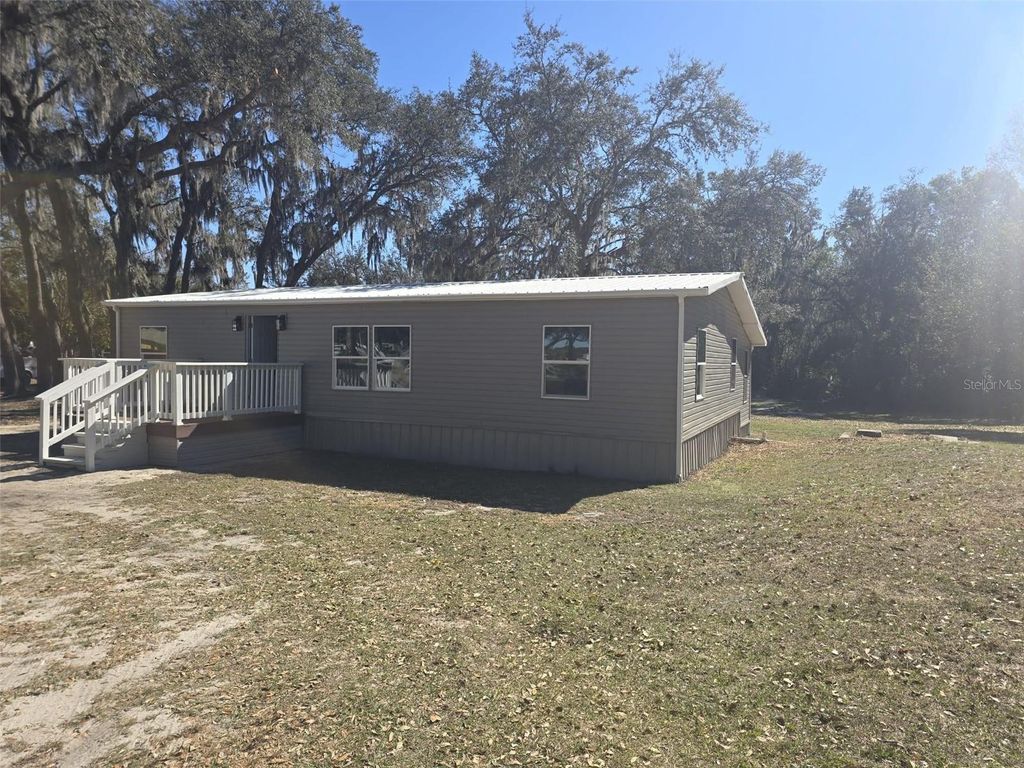 Photo of 37344 Stanford Avenue, Zephyrhills, FL 33541 (MLS # O6381689)