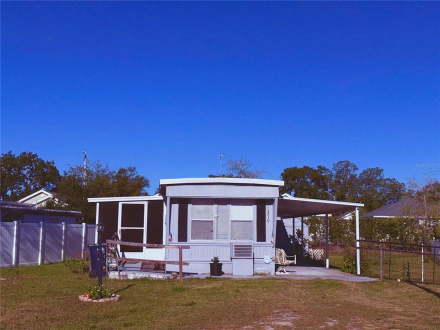 YOU OWN THE LAND!! Better Yet... NO HOA!! Even Better.... NO AGE RESTRICTIONS!! BRING THE BOAT  OR THE RV! This 2-bedroom, 1-bath mobile home features a nice-sized lot with a Florida room, as well as a spacious 43 ft long carport. There is vinyl flooring installed in the main living areas. Also included is a storage shed.  Golf cart community! Drive the golf cart to historic and vibrant downtown Tavares! Seller financing available as well!! (with acceptable terms)
