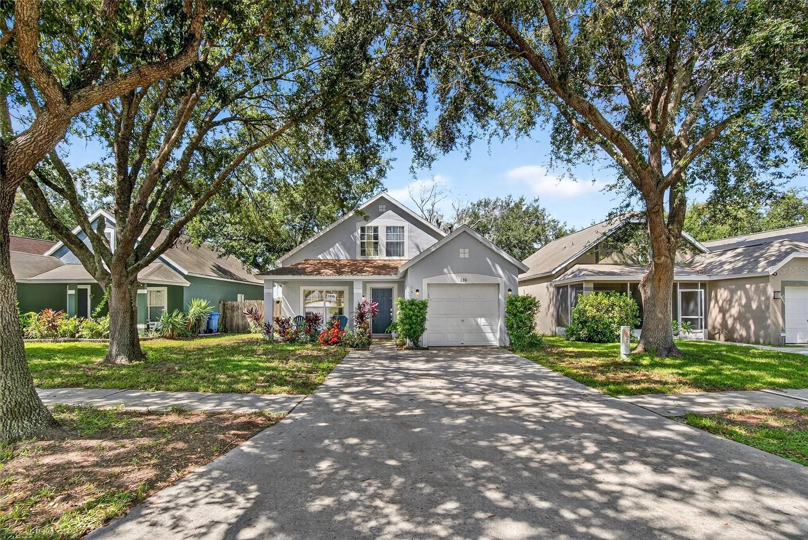 Copper Ridge Beauty – Valrico, Florida
With curb appeal straight out of a storybook, this home resembles a charming cottage surrounded by lovely trees—warm, inviting, and ready for you. Step onto the front porch and into a residence designed for comfort, style, and affordability—an exceptional value in today’s market. This spacious 4-bedroom, 2-bath, 1-car garage home features a welcoming layout and an updated light filled kitchen with ample cabinetry and a cheerful dining nook, perfect for both everyday living and entertaining.
The owner’s suite is conveniently located on the main floor and includes a walk-in closet and private bath. Upstairs, you’ll find three generously sized bedrooms and a full bath, offering plenty of flexibility for family, guests, or home office space.
Out back, the fully fenced private backyard has no rear neighbors and provides room for pets, play, and gatherings, complete with a cozy firepit to enjoy Florida evenings. Major updates include a roof (2017), giving you peace of mind.
Ideally located in the sought-after Copper Ridge community, this fairytale-style charmer offers affordability and convenience just minutes from shopping, dining, recreation, golf, schools, hospitals, and commuter routes.