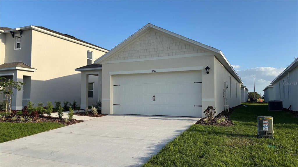 Photo of 1516 Ellesmere Avenue, Haines City, FL 33844 (MLS # O6435355)