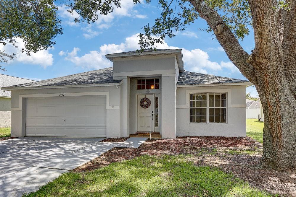 Offering $10,000 toward new flooring! Enjoy peace of mind with a roof just 5 years old and a beautifully updated kitchen completed 5 years ago as well! Welcome to Buckhorn Preserve, a beautifully maintained community of 419 single-family homes in Valrico, Florida with a low annual HOA fee. This inviting 4 bedroom, 2 bath, 2-car garage home offers a spacious open layout enhanced by vaulted ceilings for an airy, welcoming feel. The well-appointed kitchen features rich, deep-colored cabinetry that contrasts beautifully with white and stainless steel appliances, a functional island, tile flooring, and even a built-in “home management” desk—perfect for work, school, or organization. A split-bedroom design places the owner’s suite privately at the rear of the home, while three additional bedrooms and a full bath are conveniently located near the entry along with the laundry room. Enjoy cozy carpet in the living, dining, and bedrooms, plus sliders from the main living area that open to a screened lanai, ideal for relaxing or entertaining year-round. With its thoughtful layout, stylish features, and prime location in one of Valrico’s most desirable communities, this home is ready to welcome its next owner.