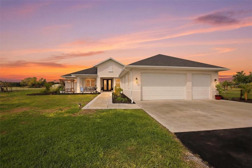 This is it! Your private country retreat just minutes from the conveniences of the city. This beautifully custom-built home is nestled on nearly six peaceful acres, offering the perfect balance of privacy and accessibility.

Relax on the inviting front porch overlooking a scenic pond filled with koi and turtles, where nature becomes part of your everyday view. Inside, the home features four bedrooms and three bathrooms with a bright, open floor plan. French doors lead to your backyard retreat, while impact-rated windows flood the home with natural light and warm Florida sunshine. 


The showpiece of the home is the stunning kitchen. A spectacular 10' x 4' center island topped with beautiful natural quartz creates the perfect gathering space for family and friends. Floor-to-ceiling white cabinetry provides abundant storage and style, making this kitchen a true chef’s dream. A large walk-in pantry adds even more convenience and functionality.
The large living room has a beautiful tray ceiling. There is a three-car garage to protect your vehicles and inside laundry room. The entire home has plank tile flooring, making upkeep a breeze. 

The spacious primary suite is a relaxing sanctuary. The spa-like bath features a quartz vanity with dual sinks, a walk-in shower with rain head, and a luxurious jacuzzi tub. His-and-hers closets and generous space make it the perfect place to unwind after a day spent enjoying the property.

Step outside and the possibilities are endless. With nearly six acres, there is plenty of room for gardening, recreation, animals, or simply enjoying the peaceful surroundings. The property is fully fenced and secured with a solar-powered entrance gate.

Located next to the Myakka Community Center, you’ll enjoy convenient access to a paved walking trail, playground, baseball field, and community activities. The side gate allows easy access to the community center's amenities. This is an ideal setting for growing or multigenerational families.

At just four years old, this home offers modern construction and peace of mind. Come experience the beauty, space, and lifestyle this exceptional property provides.