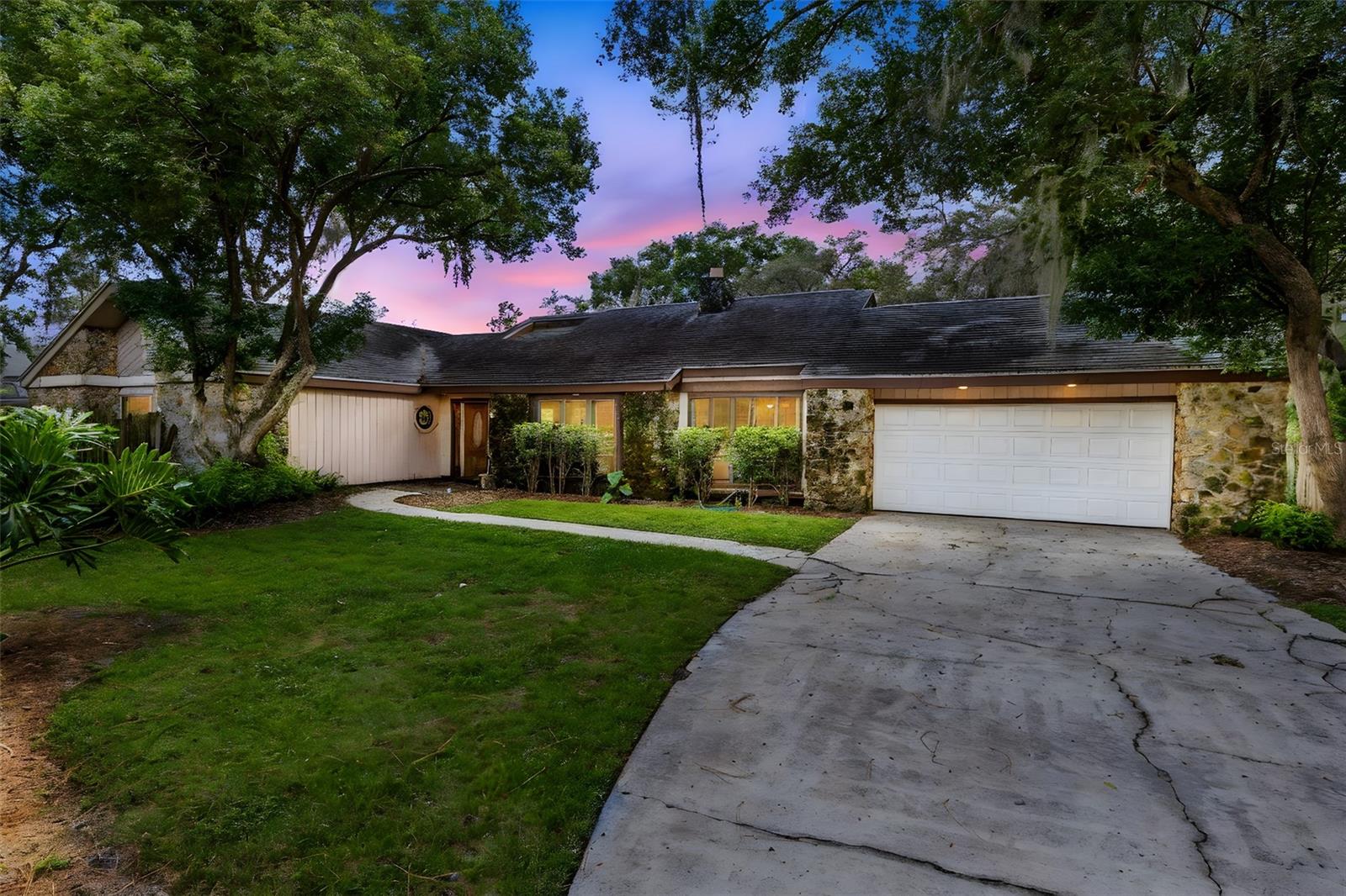 One or more photo(s) has been virtually staged. Welcome to 270 Queensberry Court, a spacious pool home in the highly sought-after Wekiva community of Longwood. Nestled on a quiet cul-de-sac, this property offers a long driveway, 2-car garage, and incredible outdoor space with a huge yard that backs up to a lake and the scenic Wekiva Neighborhood Trail. Inside, the entryway opens to a bright atrium, a formal dining room to the right, and a kitchen with a dinette to the left. The family room features a charming masonry wood-burning fireplace and easy access to the screened pool and spa. A convenient indoor laundry room also connects directly to the pool area. The split-bedroom layout includes three secondary bedrooms with a shared guest bath plus a spacious master suite. The large backyard and side yard provide plenty of space for entertaining, gardening, or simply enjoying peaceful water views. The yard is partially fenced for added privacy. While the home has deferred maintenance and awaits your updates, it offers amazing potential in a prime location. The Wekiva community is one of Longwood’s most established and desirable neighborhoods, known for its tree-lined streets, miles of walking and biking trails, and access to top-rated schools. Residents enjoy a wide range of amenities, including basketball and tennis courts, racquetball, playgrounds, and parks—all just steps from your backyard. This is a fantastic opportunity to create the home of your dreams in a vibrant Longwood location with unmatched lifestyle amenities.