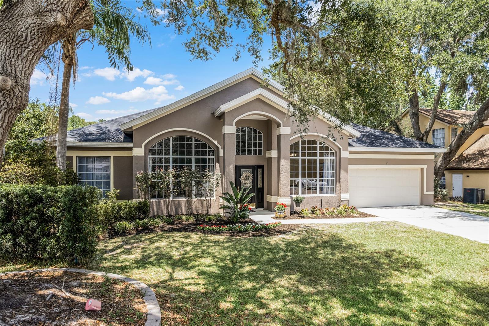 "FORE" SALE! STUNNING, one-story, DIRECT GOLF COURSE POOL HOME on large .26 ACRE LOT! A true MOVE-IN ready home nestled in a quiet cul-de-sac of Country Club Estates in Twin Rivers. Wake up and enjoy a cup of coffee sitting comfortably on the newly screened POOL back patio, overlooking the 14th Fairway! NEW ROOF and AC 2018, and whole house has been replumbed! As you walk in, you are greeted by a living room/small bonus room to the left, and a bright and airy office to the right. This home features an OPEN CONCEPT great room with a completely REMODELED KITCHEN including soft-close cabinets, stainless-steel APPLIANCES with a DOUBLE OVEN, and GRANITE countertops, along with a huge walk-in pantry. Are you looking for a separate coffee bar, because this beautiful kitchen includes a designated space for your brews and lattes! The layout features a split plan, with the en-suite primary bedroom on one side of the home, and the 3 secondary bedrooms along with 2 full bathrooms on the other side of the home. The bathrooms have been beautifully updated with seamless glass shower doors, and of course, there is a full bath that leads right out to the pool! Gorgeous wood flooring, with NEW carpet in each secondary bedroom. The interior and exterior have both been FRESHLY PAINTED, along with new landscaping. Oversized 2 car garage will even accommodate your golf cart! Zoned for the TOP SEMINOLE COUNTY SCHOOLS. Easy access to the 417 and just down the street from the Twin Rivers Golf Club and Oviedo on the Park. Also within a few minutes from UCF, Research Park, Red Bug Lake Park and the Oviedo Mall. This golf course home is private, peaceful and serene, EVERYTHING you've been waiting for, and much much MORE!