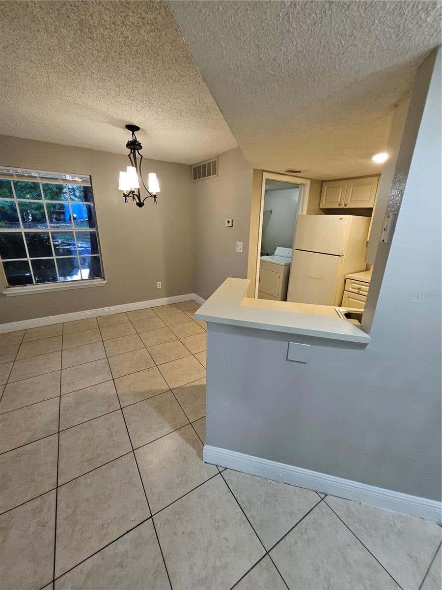 Photo of 1908 Lake Atriums Circle #15, Orlando, FL 32839 (MLS # O6432823)