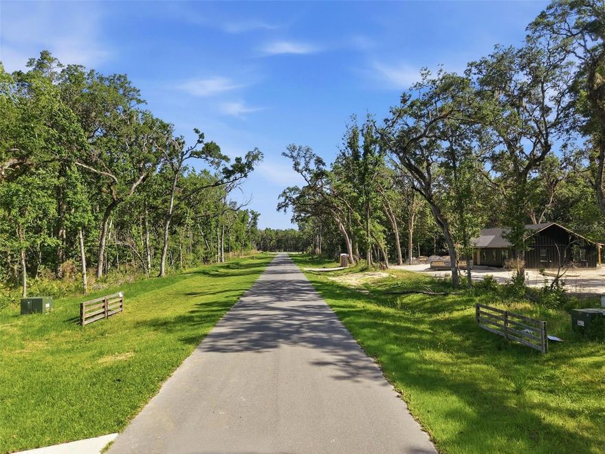 Your Florida dream home starts here — 2.5 acres in Champion Estates, Lot 2. Imagine pulling down a quiet paved road into your own slice of Brooksville, where you get to design the home you've always pictured. Champion Estates is a brand-new subdivision with just 13 total lots, and only a few remain. Owner financing available. Bring your own builder and build on your own timeline — no pressure, no deadlines. Spec homes by Palmwood Builders and ProBuilt Homes are already going up on Lots 1 and 13, giving the community real momentum. Community standards keep values strong:  Site-built homes only (no mobile/manufactured), 2,000 sq ft minimum living space, 2-car garage minimum, Underground power, well and septic, HOA only $200/year for road maintenance. And the location? Pure Florida magic. Less than 10 minutes from kayaking, paddle-boarding, and swimming with the manatees on the crystal-clear Weeki Wachee River. Spend summer afternoons at Buccaneer Bay Water Park, or catch the sunset 15 minutes away at Pine Island with its boating and fishing. The Suncoast Parkway is right around the corner — Tampa International Airport, Tampa Bay sports, dining, and entertainment are all within easy reach. Florida's top-rated beaches are about an hour away, and Disney, Universal, and Orlando's theme parks are just 90 minutes down the road. Shopping, restaurants, hospitals, and great schools are all minutes from your front door. Lots in Champion Estates are going quickly — call today before this one is gone.