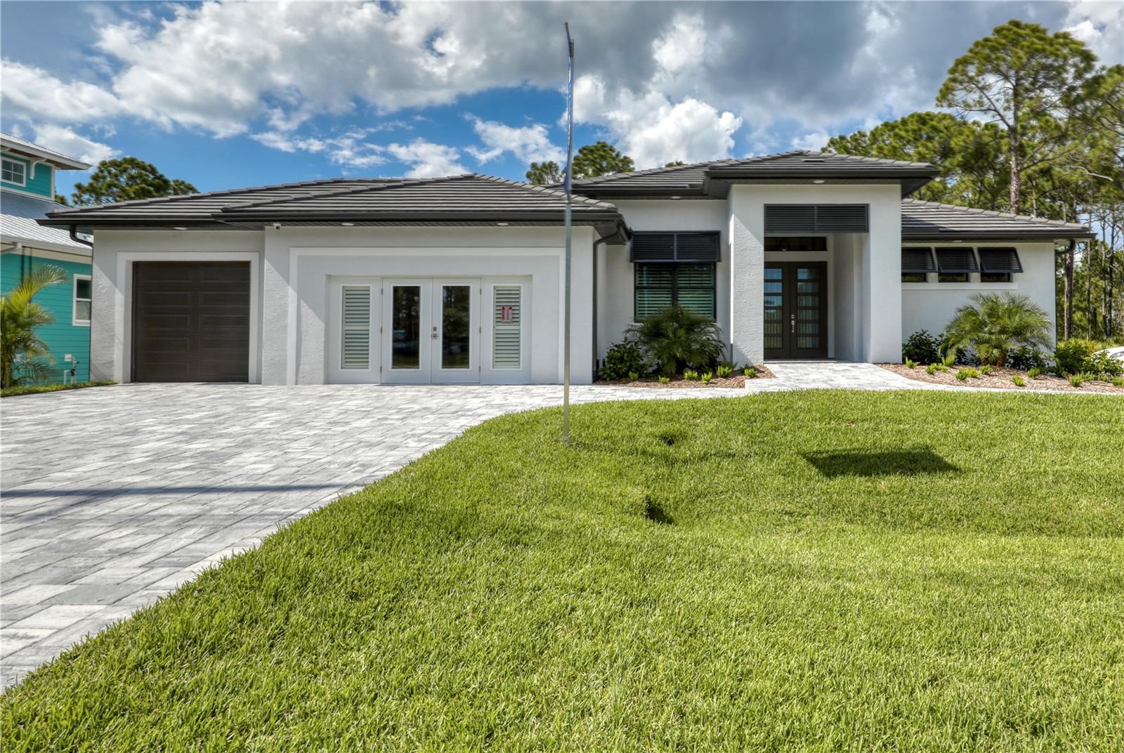 Welcome to 14194 San Domingo Blvd, a beautifully appointed 3-bedroom, 3-bath home with a spacious office, nestled in the desirable waterfront community of South Gulf Cove. This furnished builder’s model sits on a double lot with a leveled parking lot perfect for a future garage, offering ample space, luxury, and convenience.
Step inside to soaring high ceilings with trays in both the living room and primary suite, adding a touch of elegance and openness throughout. The heart of the home is a gourmet kitchen featuring a large island, quartz countertops, upgraded stainless steel appliances, a sleek range hood, built-in microwave, built in garbage cans, under cabinet lighting, soft close cabinets, large deep sink, coffee bar, bar cabinet, and a pantry—perfect for entertaining or everyday living.
The primary suite is a private retreat! Enjoy separate vanities, a private toilet, HUGE HIS AND HERS walk in closets, and fully tiled shower. The guest rooms are both large bedrooms with ceiling fans and ample closet space. The entire home is fully tiled with gorgeous wood plank tile!
The expansive open floor plan flows effortlessly into the outdoor oasis, where you'll find a screened-in pool, outdoor kitchen, and plenty of room for lounging or hosting guests. The living room features a stunning zero corner slider leading outside.
Additional features include:
• 3 spacious bedrooms + large office
• 3 full baths with upscale finishes
• Hurricane Impact Windows
• Tray ceilings in primary bedroom and living room
• Concrete Block Construction
• Tile Roof
• Wood Plank Tile Throughout the home
• Stunning Finishes
• 3 car Garage converted to office space
• Outdoor entertainment area with pool and kitchen
• Professionally Furnished and move-in ready
• Ample parking with a dedicated parking lot
• Located in South Gulf Cove with access to boating, parks, and more
Don’t miss this rare opportunity to own a showcase home that truly has it all—luxury, space, style, and location. Schedule your private showing today!
*some furnishings used for staging purposes
