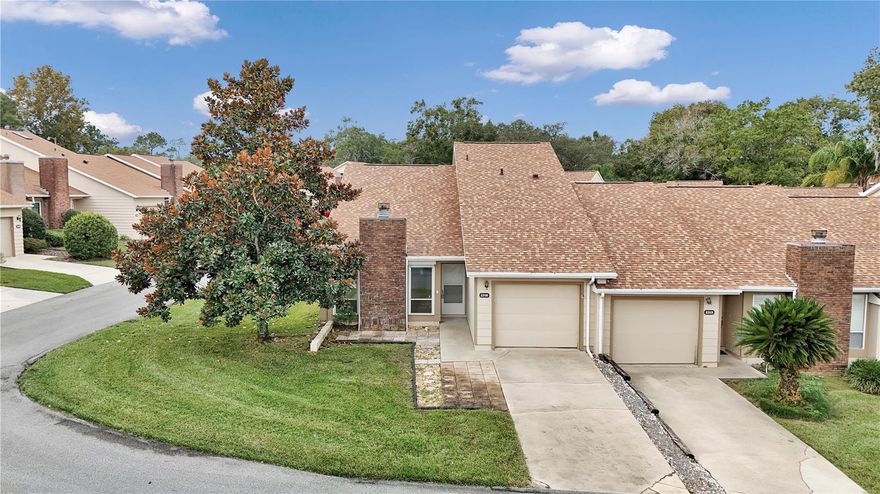 Welcome to this inviting 2-bedroom, 2.5-bath townhome in a peaceful gated community within the heart of Ocala. Offering 1,507 sq. ft. of living space, this two-story residence combines comfort, convenience, and charm — perfect for first-time buyers, downsizers, or anyone seeking low-maintenance living in a prime location. Step inside to discover vaulted ceilings, a spacious living and dining combo, and a cozy wood-burning fireplace that creates a warm gathering space for family and friends. The kitchen comes fully equipped with modern appliances including a range, refrigerator, dishwasher, and microwave. Upstairs, you’ll find spacious bedrooms with walk-in closets, a wet bar, and ample natural light throughout. The primary suite is conveniently located on the main floor and features a private bath, large closet, and tranquil views of the enclosed patio. Enjoy Florida living year-round on the screened and covered rear porch, perfect for morning coffee or evening relaxation.