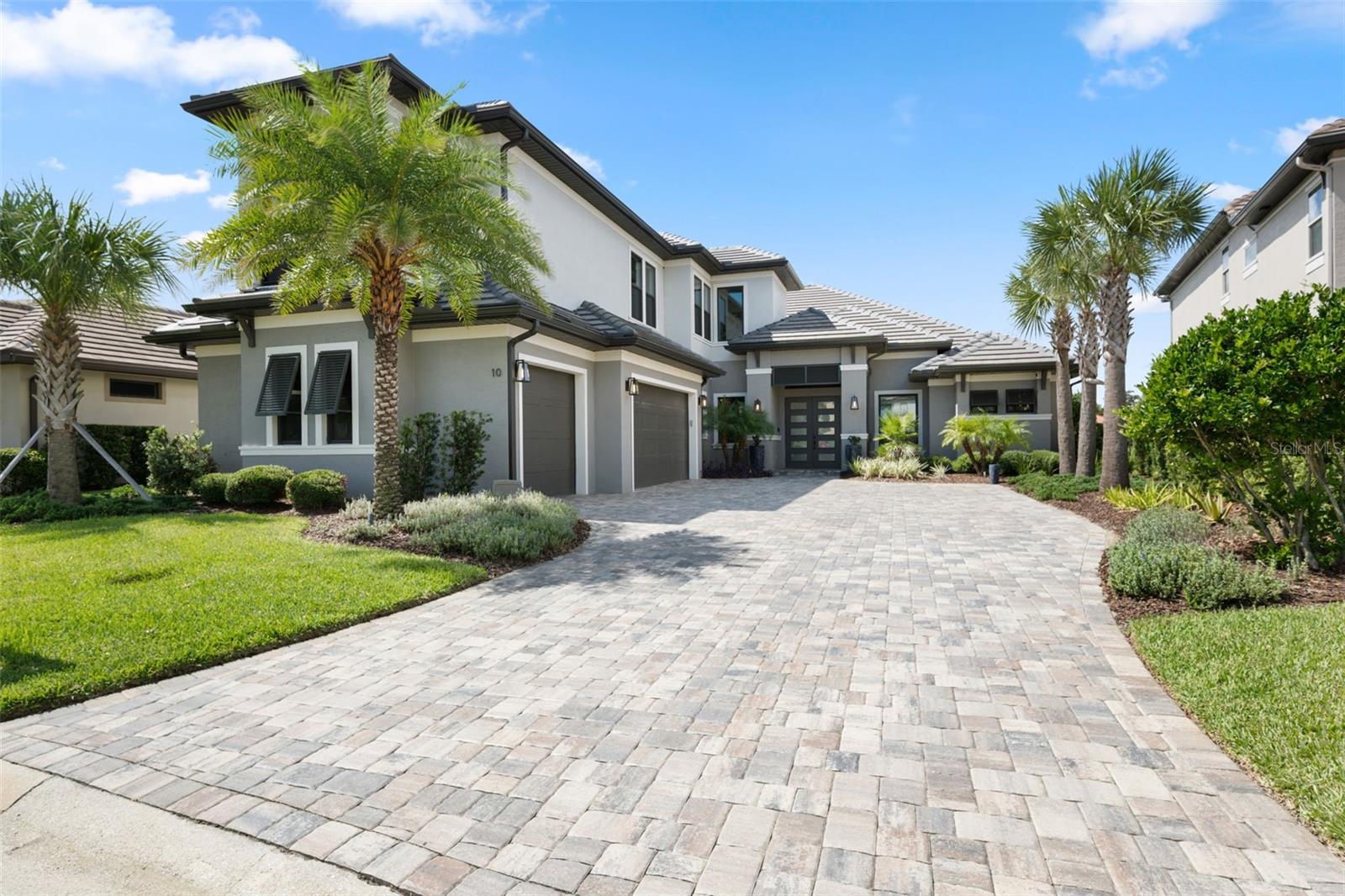 Welcome to a neo-modern design, where ocean breezes and coastal living come together. Recently built, custom-crafted residence invites you to experience life in Ocean Hammock, a private, gated community — a neighborhood known for lifestyle amenities including golf, ocean beach access, and resident security. Paver driveway and side-entry garage provide convenience and guest-friendly parking, framed by manicured landscaping and swaying palms that capture Florida’s coastal elegance.
-Step Inside- the striking main entryway, you are greeted by 3,590 square feet of luxury living. Designed in 2022 for multi-generational comfort and entertaining, the home seamlessly blends open spaces and intimate retreats. Soaring ceilings and natural light bring warmth, while custom finishes create a rich, inviting atmosphere.
-Living & Entertaining Spaces- The heart of the home beats in a chef’s kitchen with gas fired range and hidden entry ‘walk-about’ storage pantry, all over looking an expansive great room, where high ceilings and high-end fixtures, fine cabinetry, and designer details set the stage for both casual family gatherings and and social entertaining. The great room is easily sectioned into multiple areas to seat and attend both small and large groups. Large windows frames provide serene water views, while grand 10 by 24 ft easy slide doors open a thruway space onto a covered lanai enclosing the integrated pool/spa, fire pit and spacious grilling areas.
-Outdoor Living- Set on a parcel that views tranquil ponds, the backyard maximizes enjoyment of Florida’s natural beauty. A screened pool with integrated and heated hot tub is surrounded by travertine tile decking with a gas fired pit — ideal for morning swims, sunlit afternoons, or evening cocktails under the stars. This well planned outdoor space ensures privacy, peace, and connection to the community’s lush surroundings. A convenient half bath is convenient for pool use. The home and pool are a short walk to the Hammock’s sandy coquina beaches the produce a never-ending set of surfer friendly waves. The beaches are pet friendly including, horseback riding in designated areas.
-Private Retreats- The owner’s suite is a haven of relaxation with a spa-like bath, custom closets, and tranquil views. Additional bedrooms include guest suites with full baths, providing privacy and comfort for family and visiting friends.
-Ocean Hammock Lifestyle- This home is more than a residence — it’s an entry into one of Florida’s most exclusive communities. Here, you’ll enjoy world-class golf, ocean beach access, and a secured, gated neighborhood. Private oceanfront county club offers golf 2 locations. Memberships provide 36 holes at the Tom Watson and Conservatory courses. Enjoy the area’s finest dining in upgraded club house, dining rooms and olympic pool. Private neighborhood pool and club house, just step away.
-See It to Believe It! While photos capture glimpses of this home’s beauty, they cannot convey the fine craftsmanship, thoughtful upgrades, and timeless design that set it apart. Opportunities like this are rare in Ocean Hammock. To truly appreciate the detail and quality, you must experience this home in person. Offered furnished including furniture, fixtures, finishings. Owner will remove artwork and personal items as listed on inventory addendum.
*** Schedule your private tour today and discover why this residence is a most exceptional offerings in this exclusive community ***