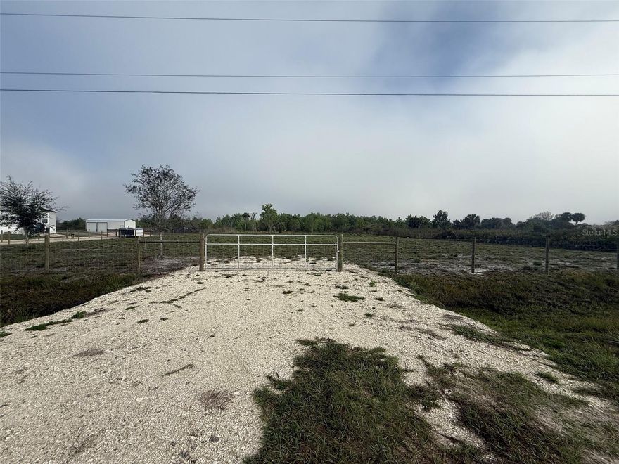 Rare opportunity in Okeechobee! Two adjoining parcels being sold together as one expansive 2.5-acre homesite. Conveniently located just off Peavine Trail, a main paved road, this property offers easy access while maintaining a peaceful, rural setting. Approximately 1.50 acres have already been cleared, saving you time and money. Property features an installed culvert and fenced frontage for added convenience and access. Electricity is available at the street, making it easier to plan your future build or investment. Plenty of room for your custom home, workshop, or recreational use. Don’t miss this versatile land opportunity in a growing area!